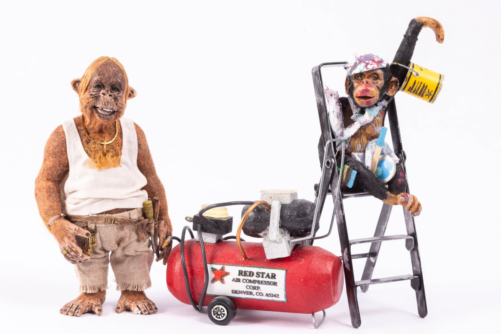 Todd Krueger Orangutan & Chimpanzee Painter: Todd Krueger Orangutan in work tee shirt and pants with a broken toe. He's wearing a gold chain and has chest hair. His wrist was broken, and a mark there, please note. He's standing next to an air co