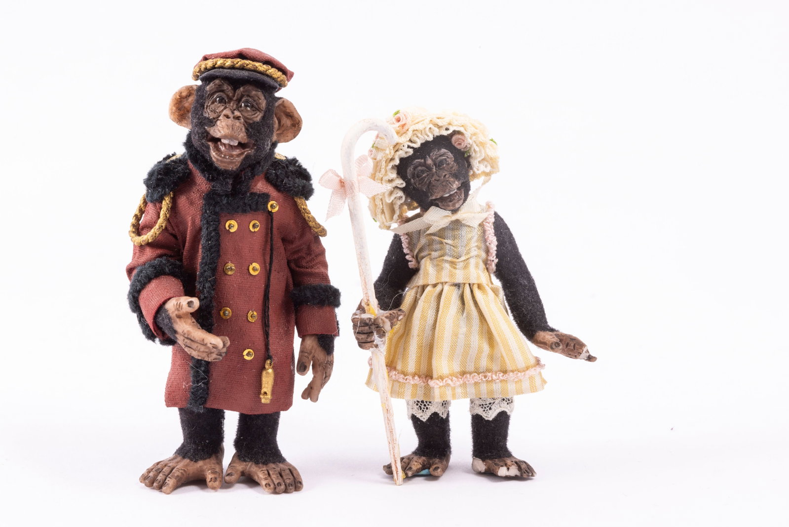 Todd Krueger Chimpanzee's Dressed as a Porter & Little Bo Peep: The chimpanzee male is dressed as a porter, and has a whistle and coat and hat. He's by Todd Krueger, signed on the bottom. The other chimpanzee is dressed as Little Bo Peep. Please note her hands and