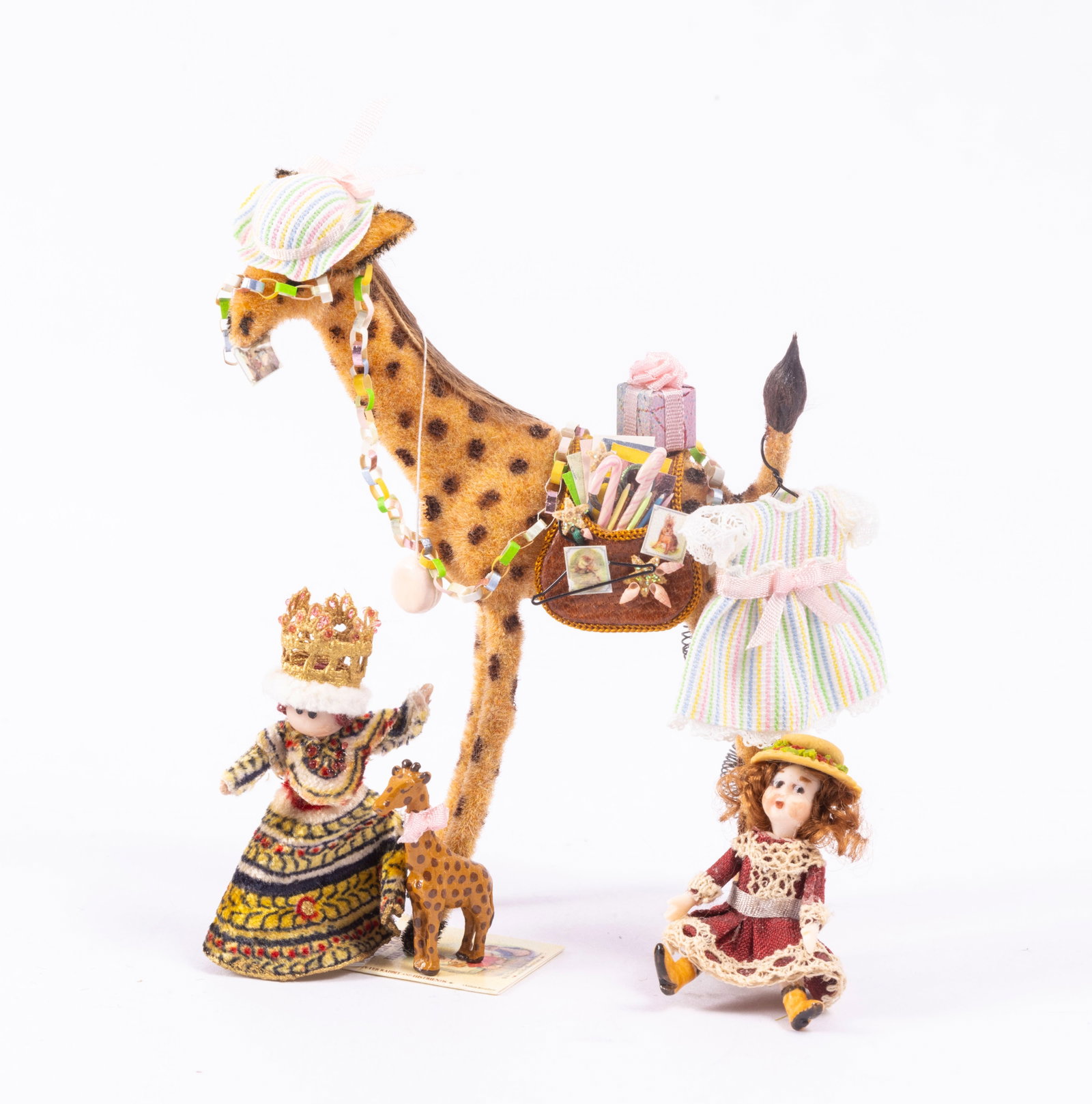 Artisan Made Toys with Tall Giraffe: Tall giraffe decorated by Cheryl Warder. In addition, a handmade queen doll, and a little doll in burgundy dress.