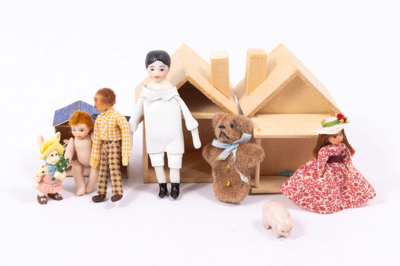 Primitive / Old Fashioned Children's Toys: Porcelain Ethel Hicks doll, handmade wooden small dollhouses, puppet teddy bear, porcelain pig, doll in dress and hat, sculpted little man doll in plaid, jointed small porcelain baby and a bunny.