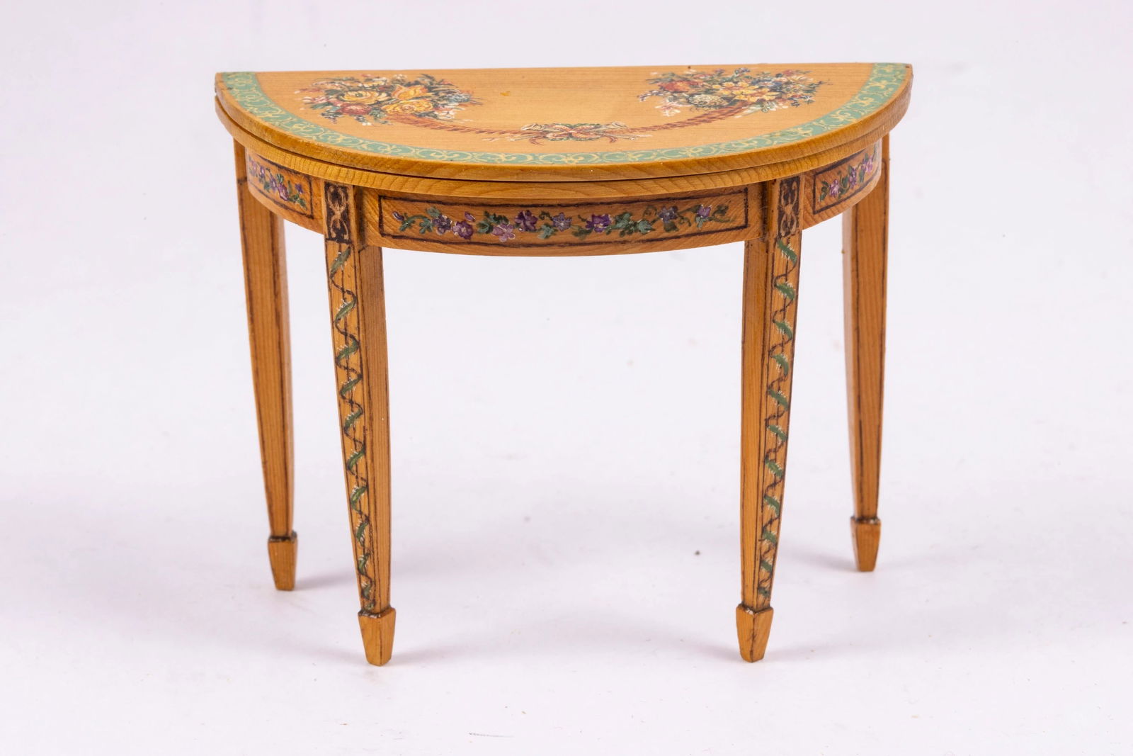 Janet Reyburn Painted Table with Flowers: This is a wonderful hand painted table by Janet Reyburn of South Africa. Wonderful painted scene with flowers underneath and on top of the table. The table folds in half.