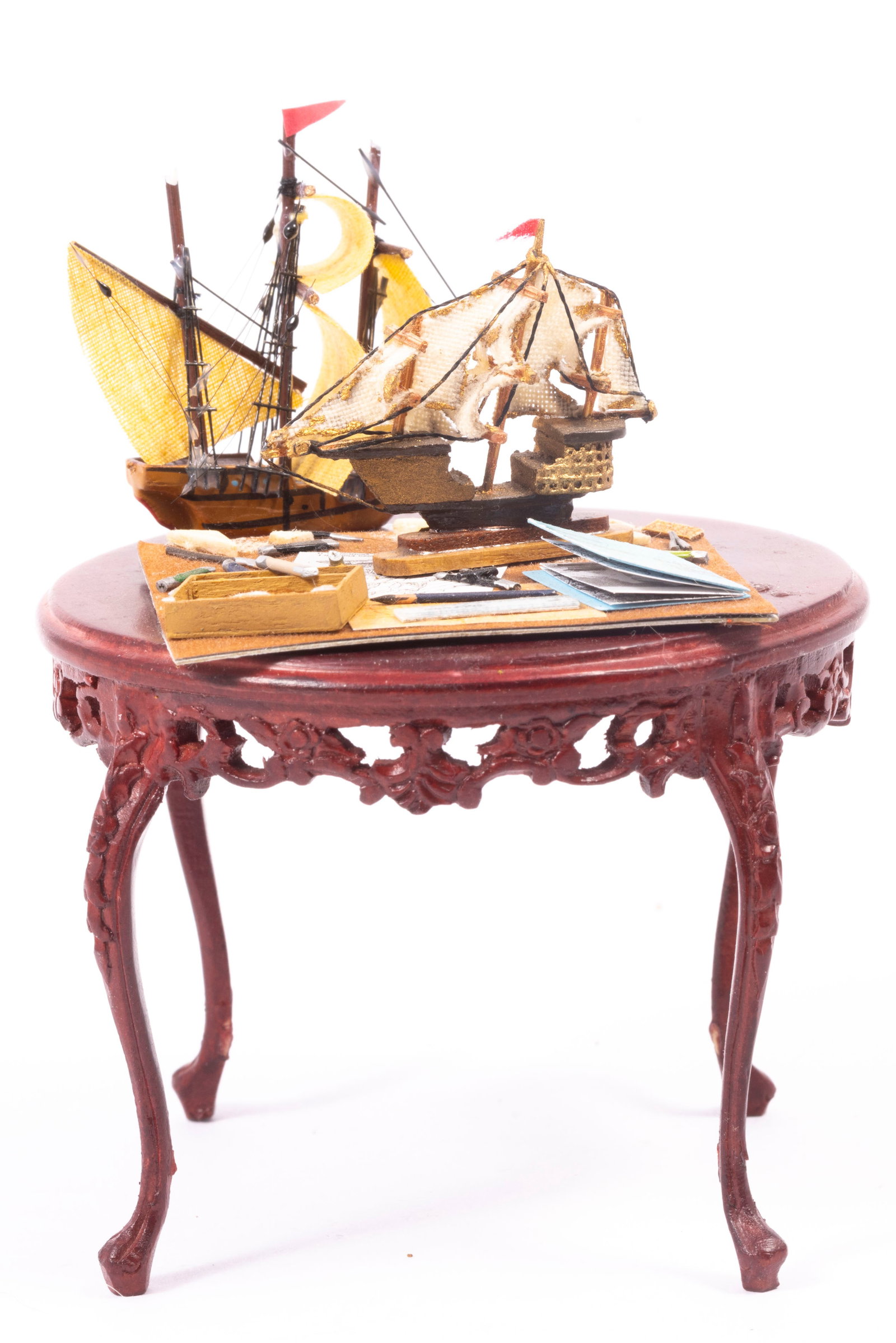 Klass Schultz Ship in the Making & Ship with Bespaq Table: Klass Schultz ship in the making as well as an additional ship that is a commercial piece. There's a round Bespaq mahogany table as well with detail. Table measures: 3" x 2 1/2" tall
