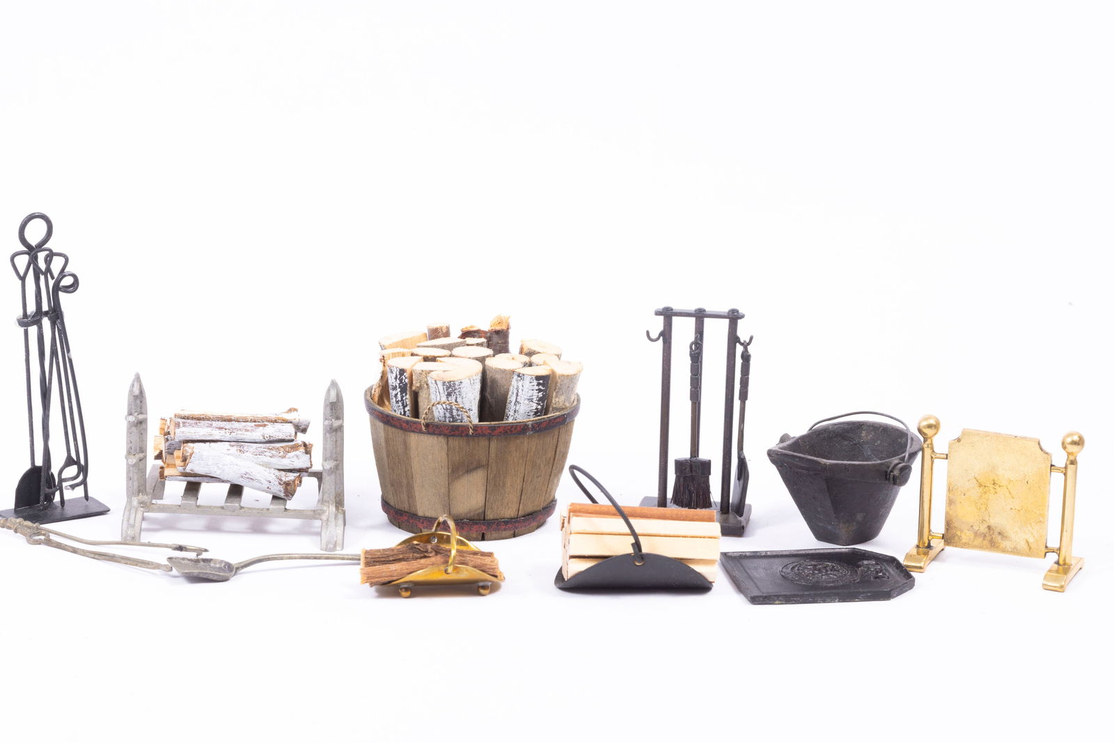 Colonial / Old Fashioned Fireplace Accessories with Black Metal: Al Chandronnait half barrel with firewood logs, black metal fire back, black tools on stand, black firewood holder, black metal coal scuttle, metal fire grate with matching tools, small brass log hold