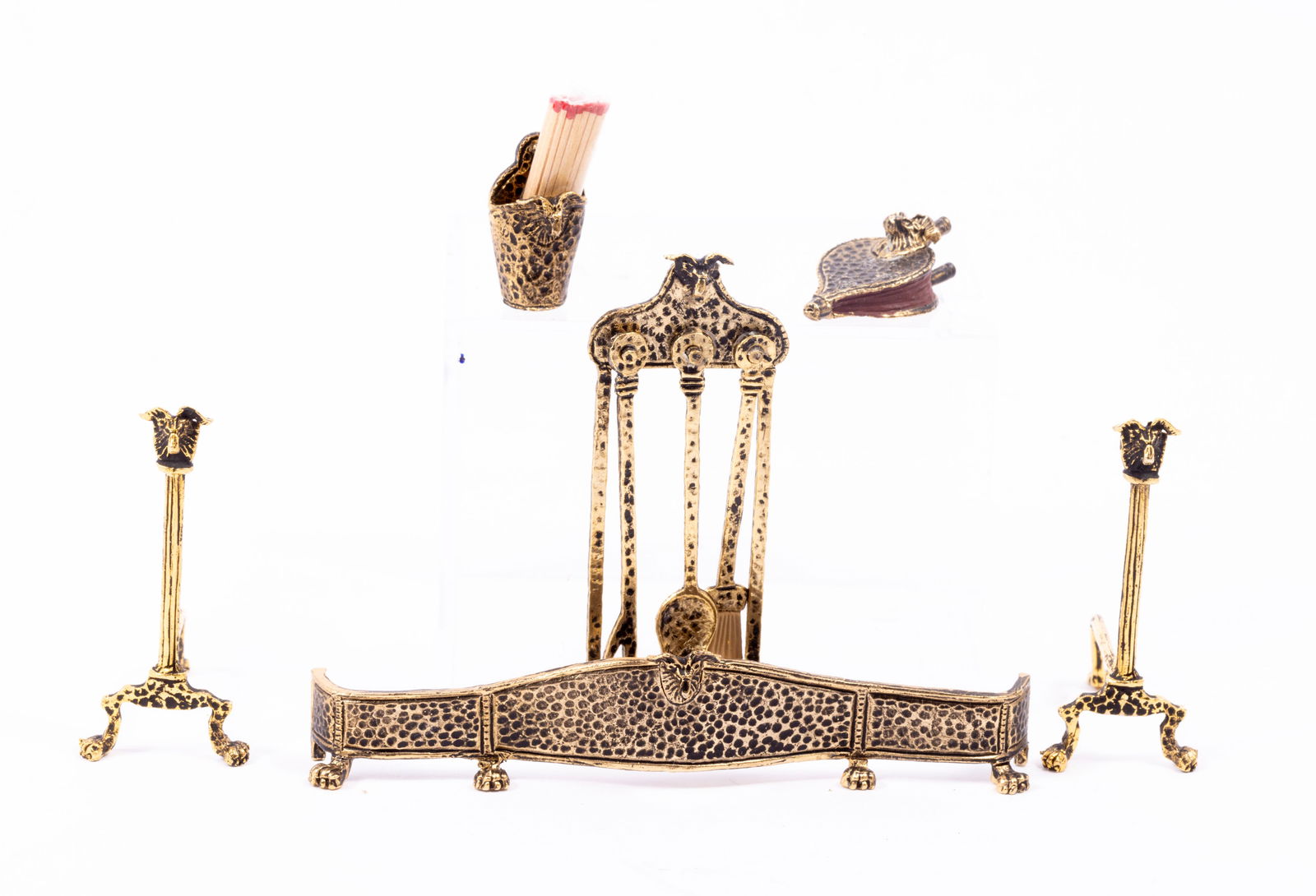 Brooke Tucker Ram's Head Fireplace Accessories Assortment: Brooke Tucker fireplace assortment of accessories. There's a Ram's Head fender, andirons, bellows, fireplace tools, and matches holder with matches.