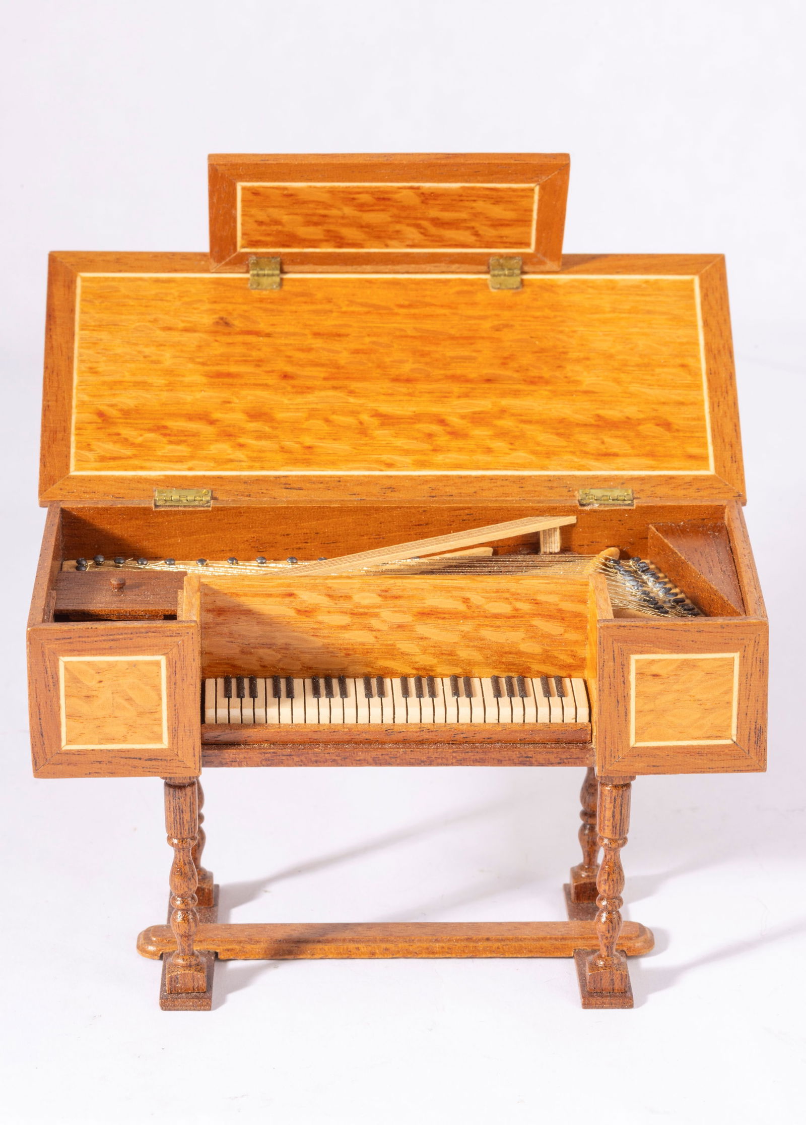 Wooden Piano by DAWN Dahn: This is a hand made wooden piano by Dawn Dahn. The piano is signed on the bottom.