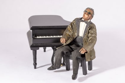 Ray Charles Doll on Black Grand Piano