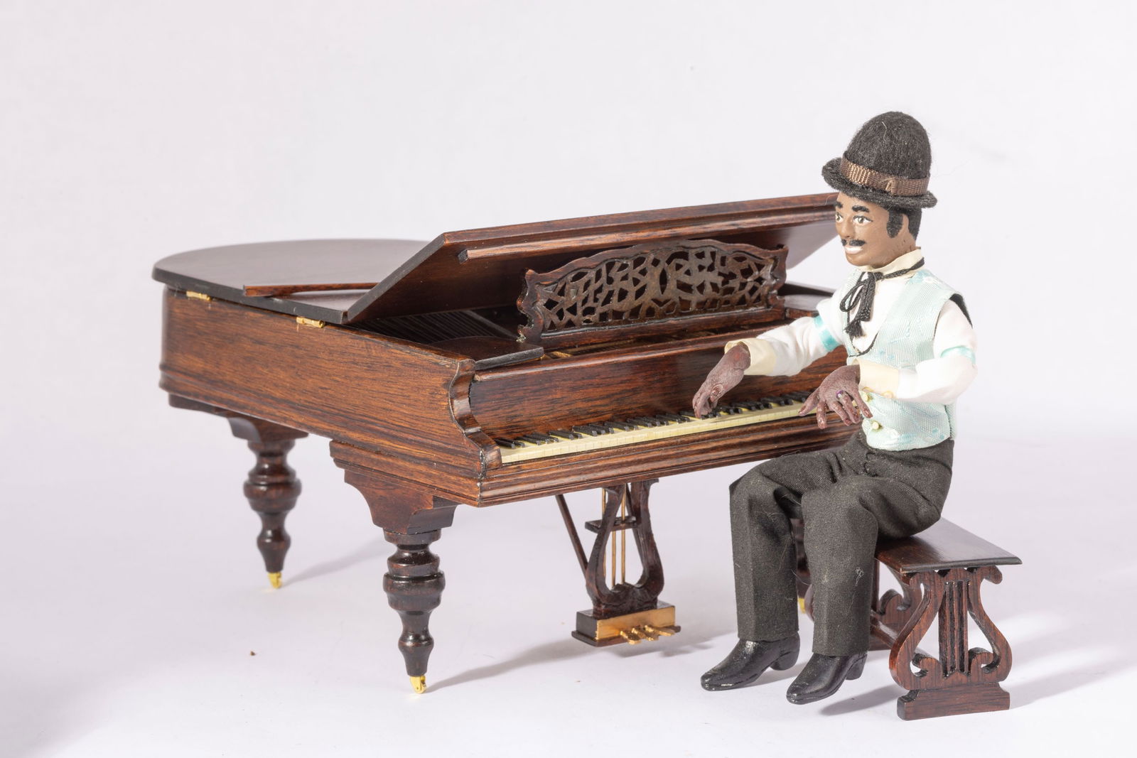 Handmade Male Piano Player Doll - (Doll Only): This is a handmade and dressed piano player doll. She's sitting, but can stand, and his fingers are out to play all sorts of music. Auction is for the doll only, not the piano.