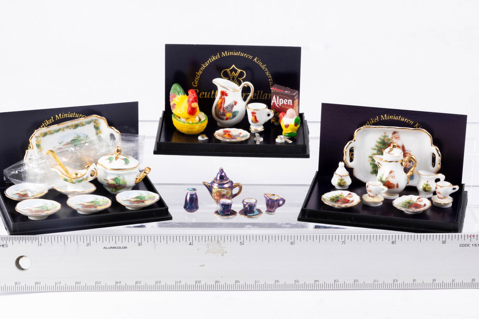 Reutter Porcelain Assortment: Christmas coffee porcelain set, a breakfast set, a Mallard soup set and a luster set in purple, all by Reutter Porcelain.
