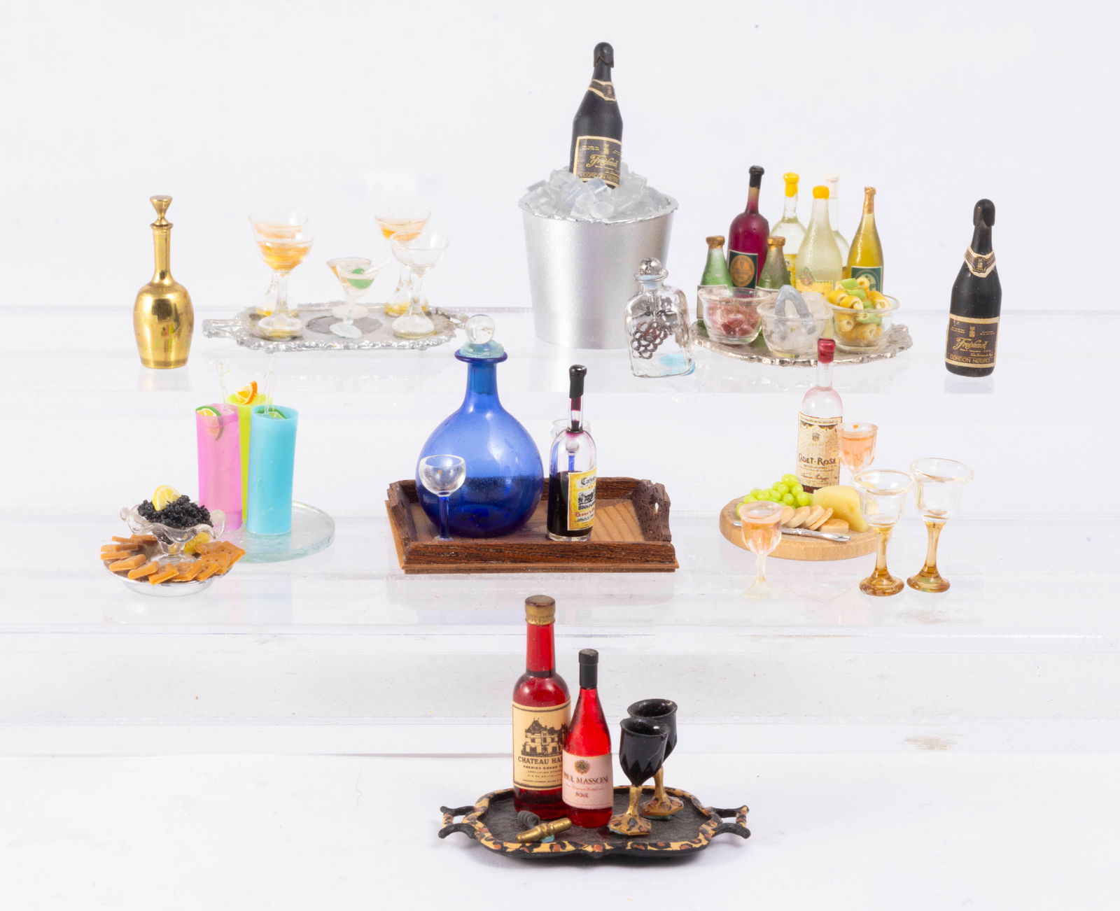 Drinks / Beverages Assortment with Caviar: A variety of cocktails, wine and champagne. There's also a dish of crackers and caviar. Three colorful drinks, drinks on a tray with ice and cherries and lemon and lime twists. There's a wooden tray w