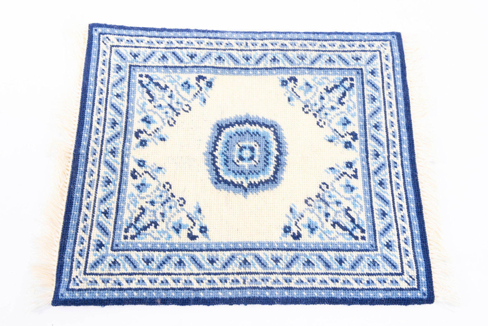 Needlepoint Blue & White Asian Inspired Rug: Needlepoint blue and white Asian rug. Nicely made with fringe.