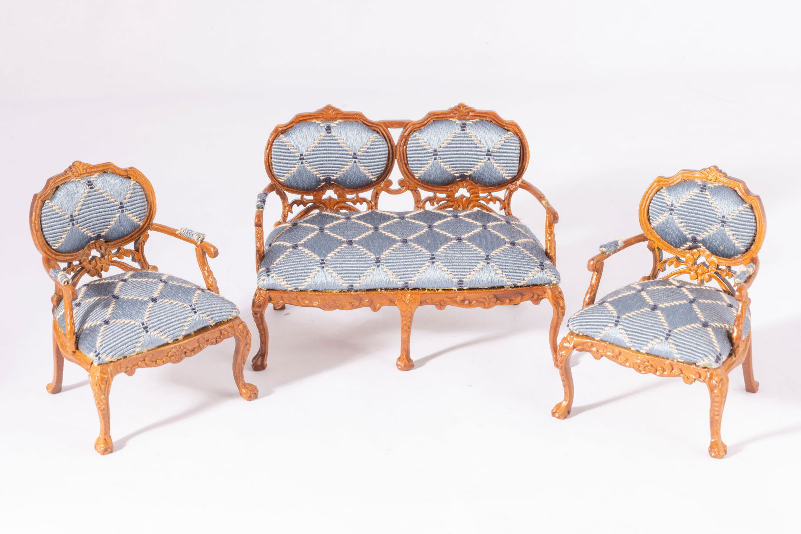 Bespaq Blue Living Room Set: Bespaq blue living room set with sofa and 2 chairs with X pattern throughout. One arm rest fabric is missing on the couch as seen in the photo.