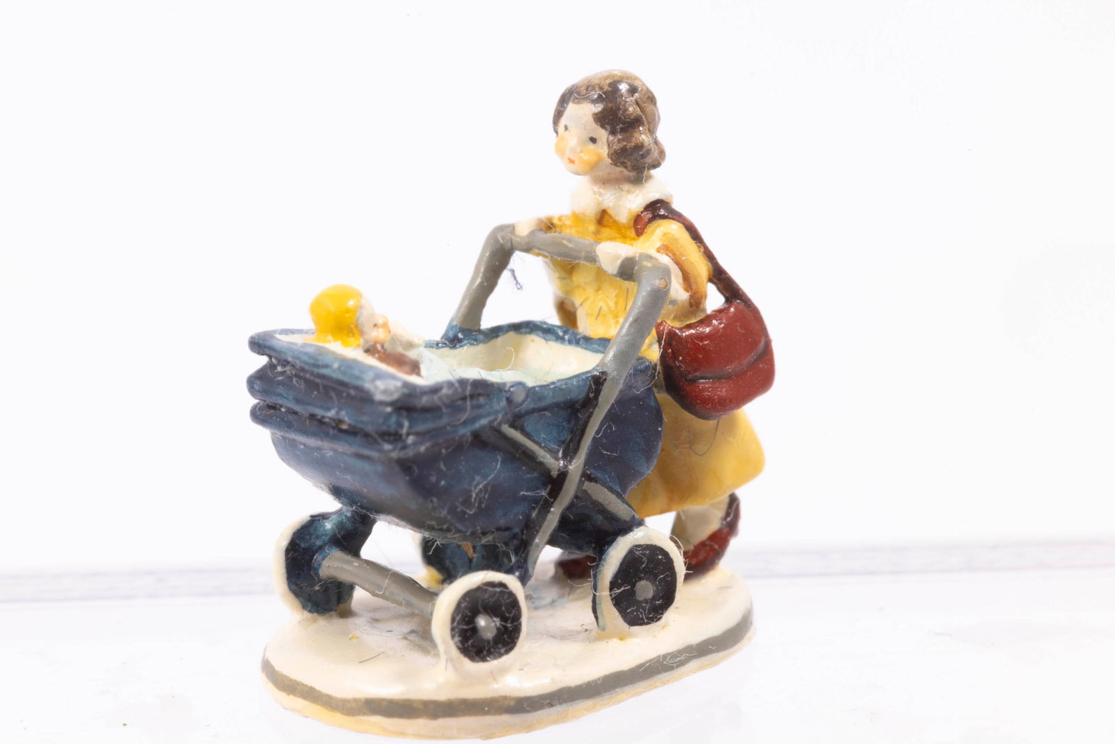 Goebel Olszewski Mother Pushing Baby in Carriage: Goebel Olszewski Mother Pushing Baby in Carriage. Gold label underneath. So tiny!