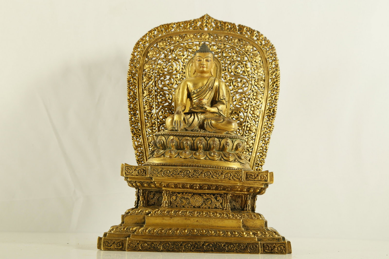 An Unusual Gilt-bronze Figure of Medicine Buddha: An Unusual Gilt-bronze Figure of Medicine BuddhaChinese Ming Dynasty Mark of Yongle(1403-1424)Size:20cmx13cmx30cm