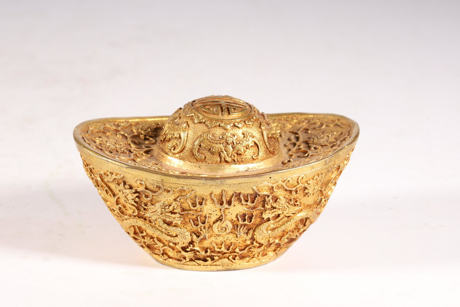 A Fine and Exquisite Gilt-bronze Dragon Pattern Gold: A Fine and Exquisite Gilt-bronze Dragon Pattern Gold IngotChinese Qing Dynasty Mark and Period of Qianlong (1736-1795) Sizeï¼š11cmX7.2cmX6.1cm