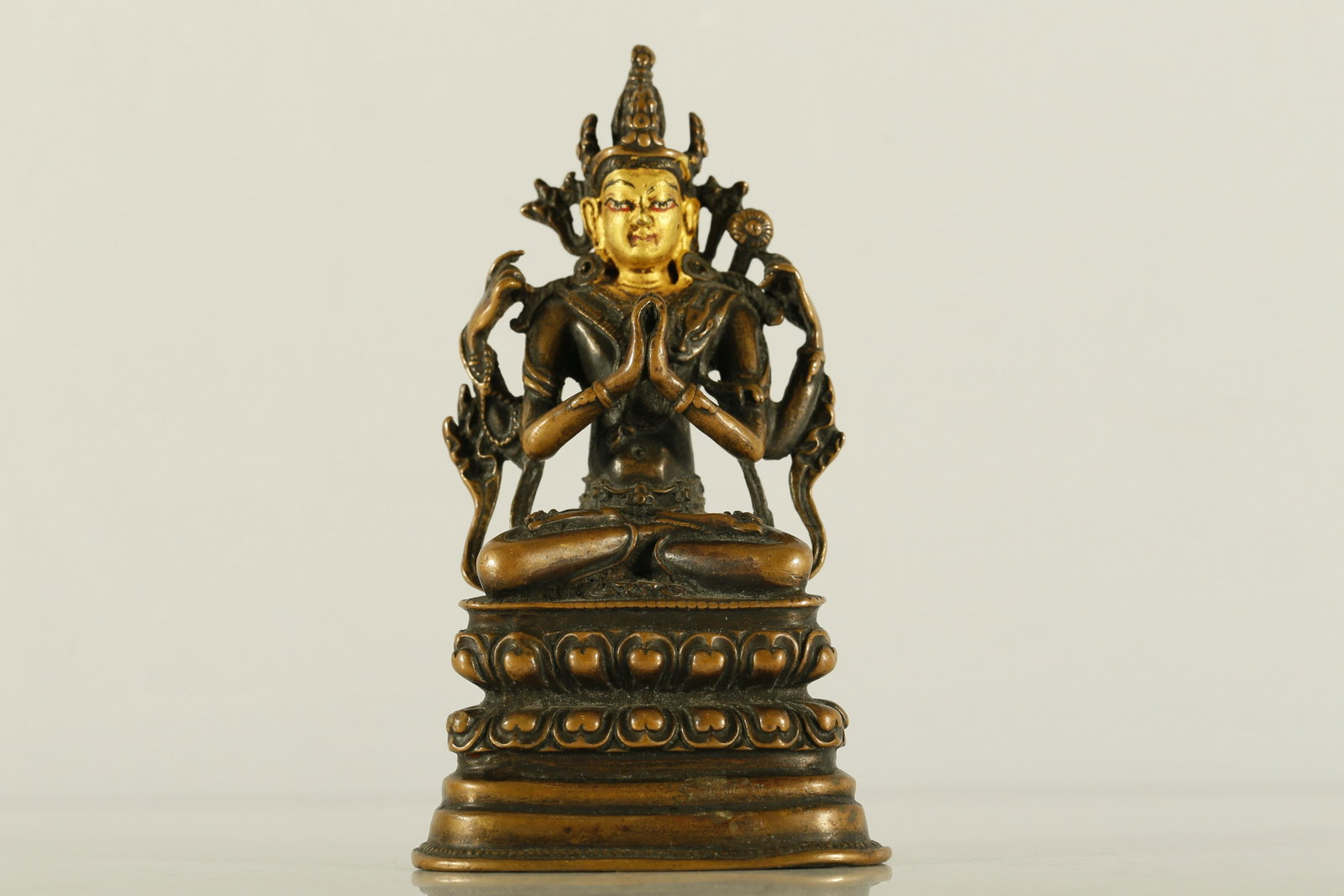 A Rare Gold-painted Copper Figure of Guanyin: A Rare and Exquisite Gold-painted Copper Figure of Guanyin with Four Arms 14-15th Century Size:7cmx5cmx12.5cm