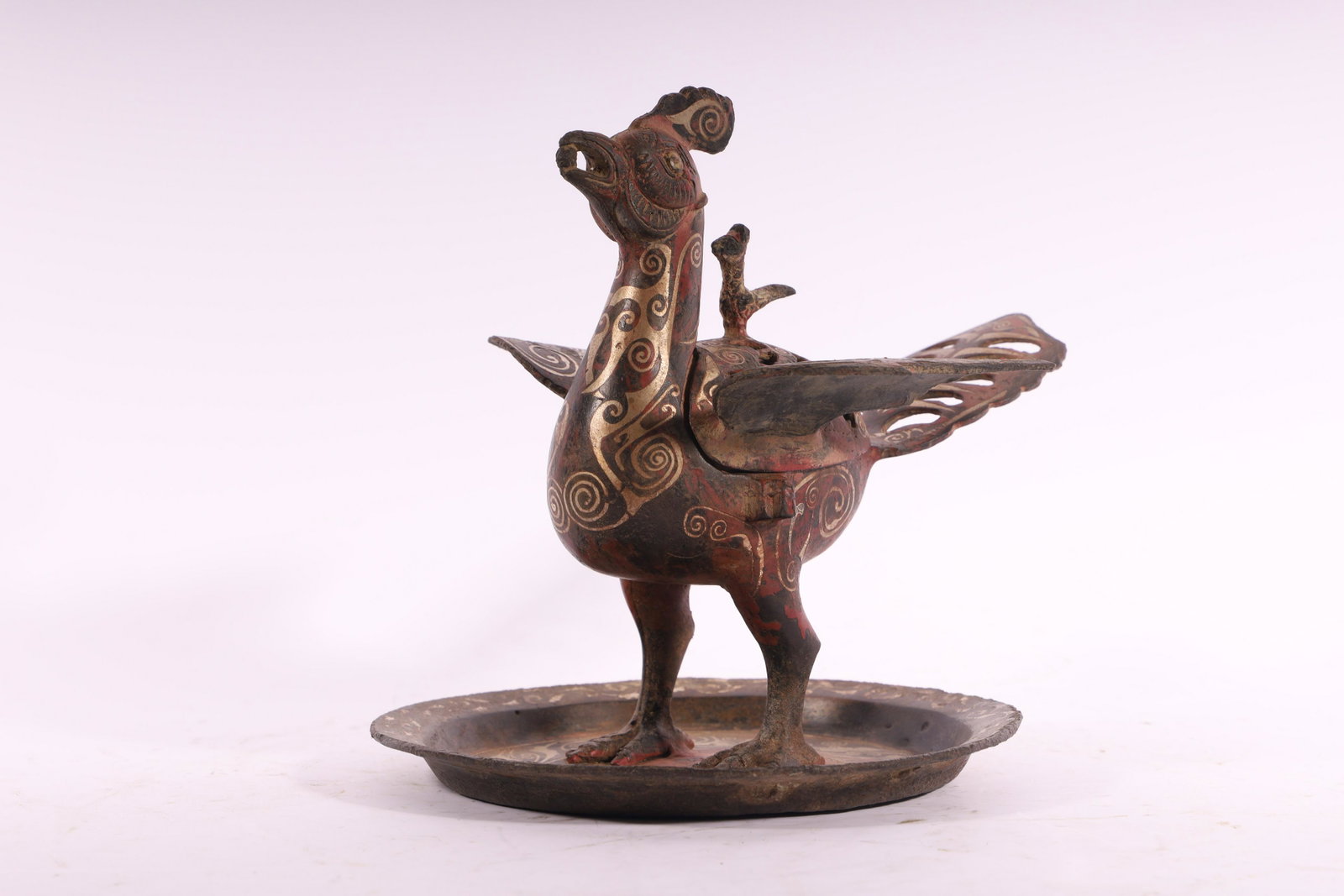 An Unusual Gold and Silver Inlaid-Bronze Bird Censer: An Unusual Gold and Silver Inlaid-Bronze Bird Censer Chinese Han Dynasty Size:19cmX21.3xm