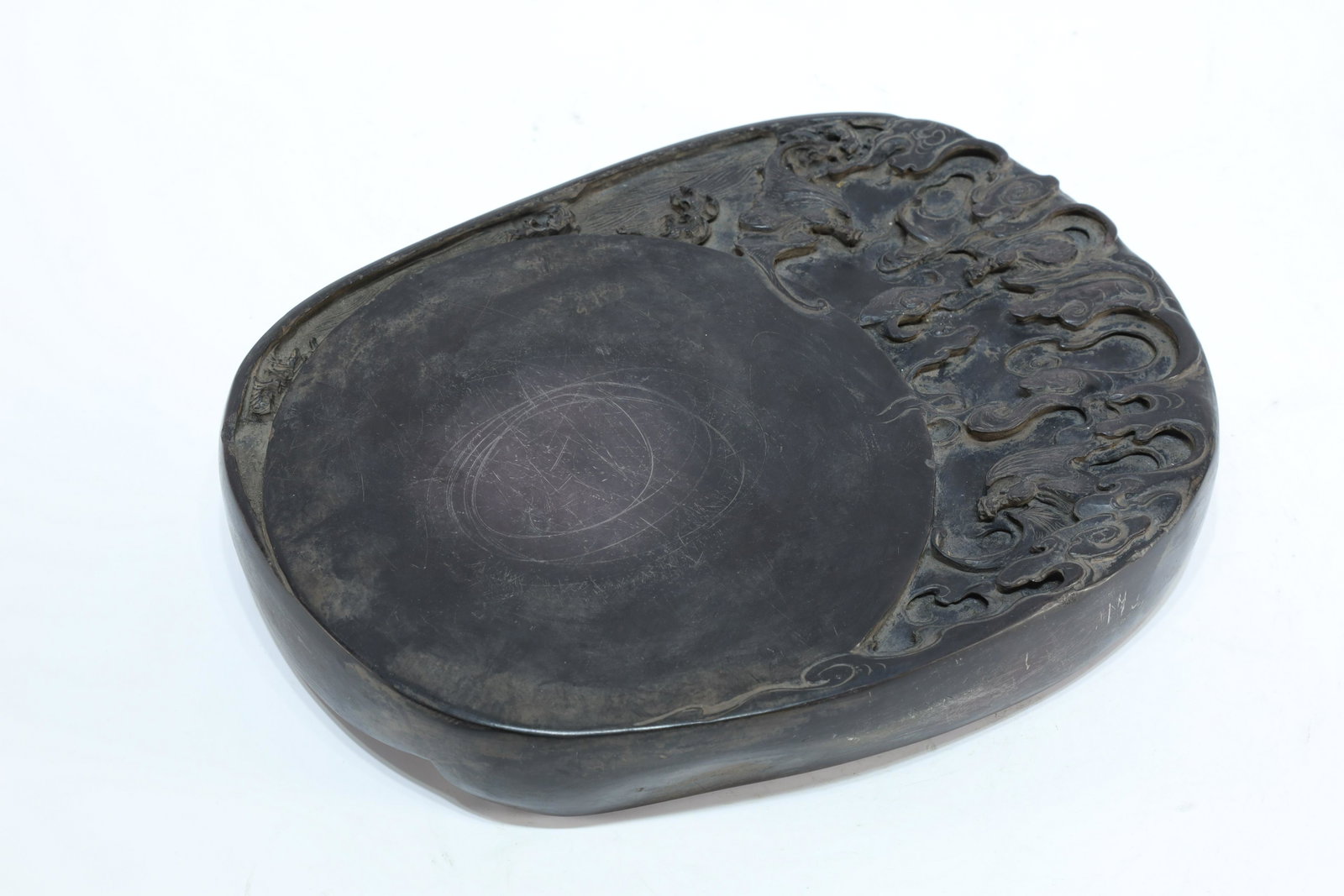 An inscribed Duan inkstone: An Exquisite cloud and bat pattern poem inscribed Duan inkstone, an art piece marked by scholar Qian Daxi in Chinese Qing Dynasty. Size: 46.5cmx20cmx4.3cm