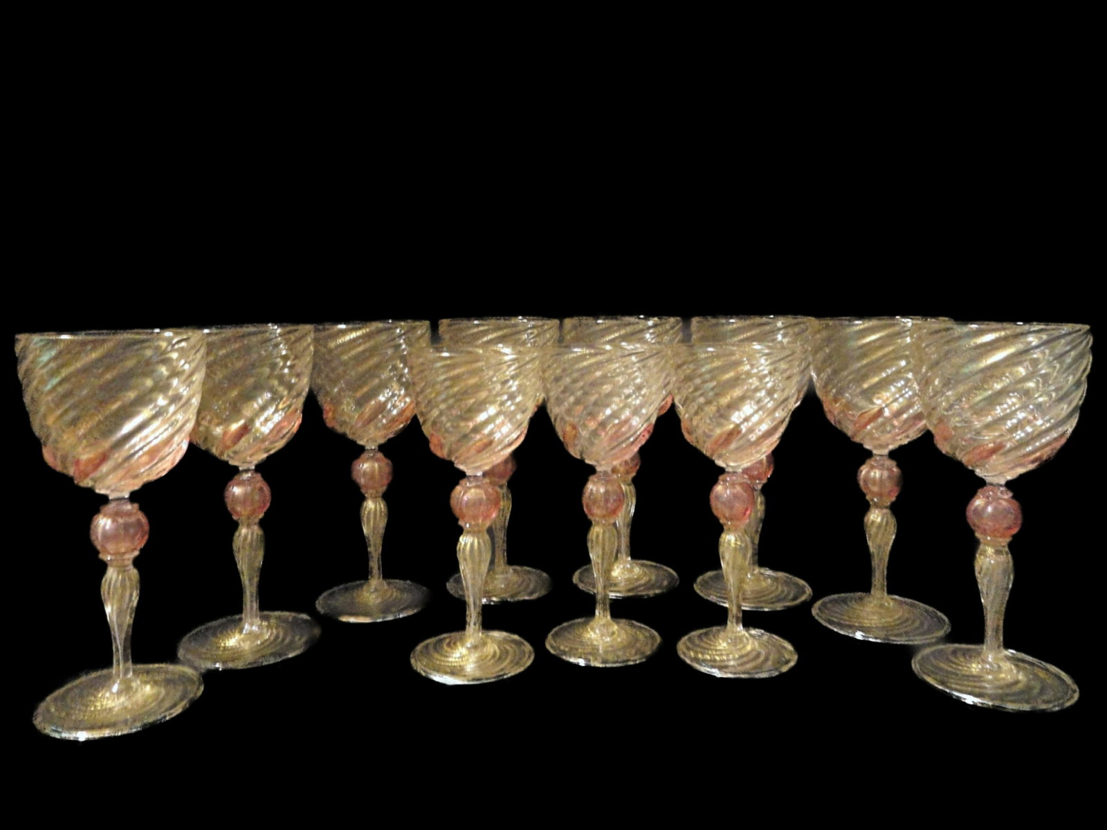 Venetian Wine Glasses Gold Fleck & Pink Swirl Salviati: This is a set of 8 large wine glass and 3 smaller wine glasses. They are RARE Italian Venetian hand made blown glass. They have a beautiful swirl design with gold flecks and pink accents. Depending on
