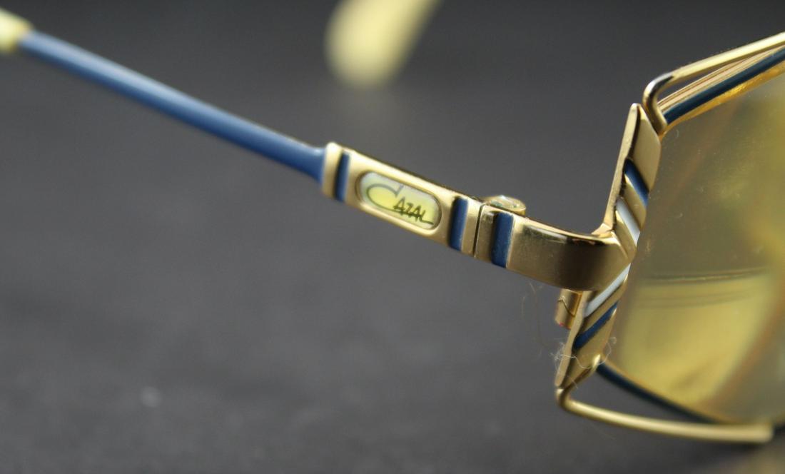 Vintage Cazal Sunglasses: Unisex-Gold Metal and Blue&Whie Enamel Detail. 63mm Lens-7 Sided. Good Condition.