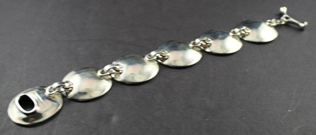 Designer Sterling Bracelet.: Sterling Silver Convex Disk Link Bracelet. Marked & Signed- 925 China RLM Studio- Silversmith/Designer Robert Lee Morris. Weight 1.71 ozt. 8 1/2" Long. Fine Condition.