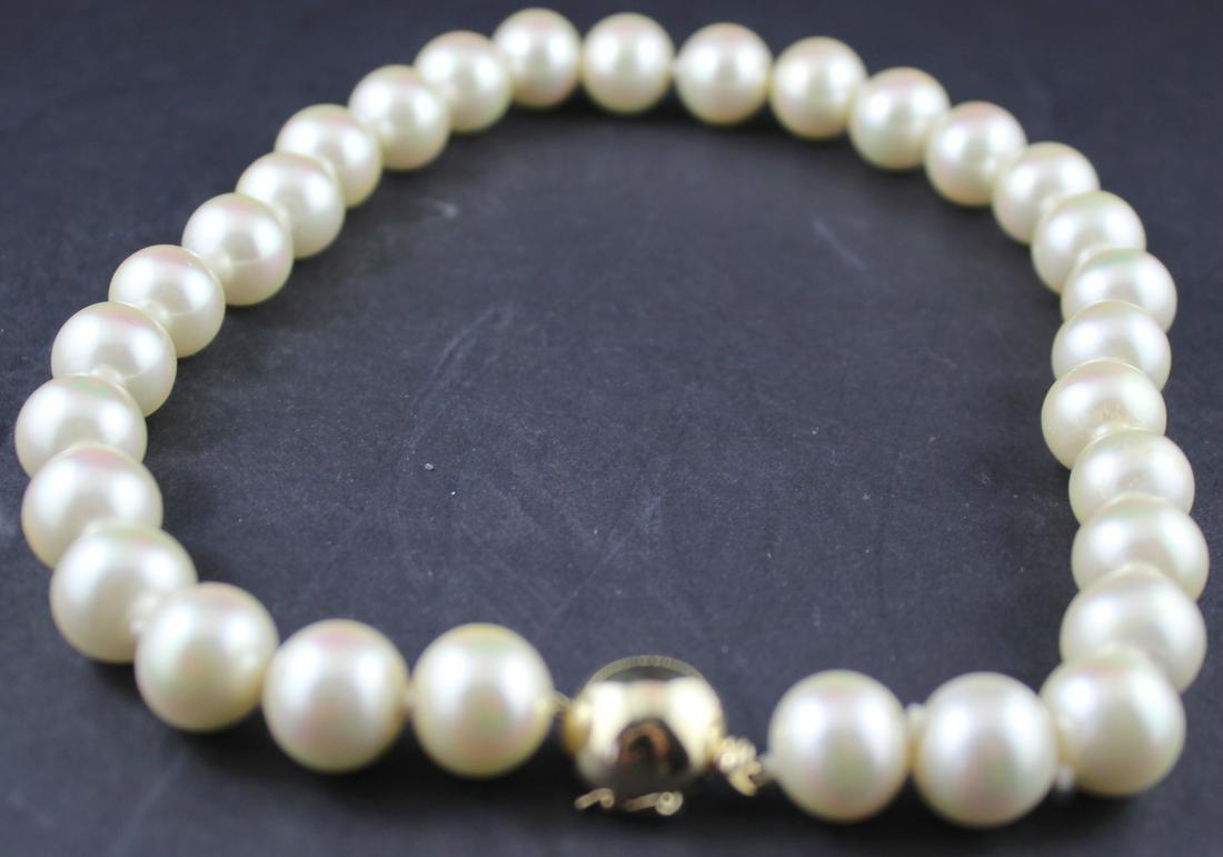 14kt & Pearl Choker Necklace: Fine Ladies 12mm South Sea Pearl Necklace-16" Choker with 14kt Yellow Gold Half Pearl Shape Clasp+Safety Catch. Excellent Color and Size Matched. Marked. Fine Condition.