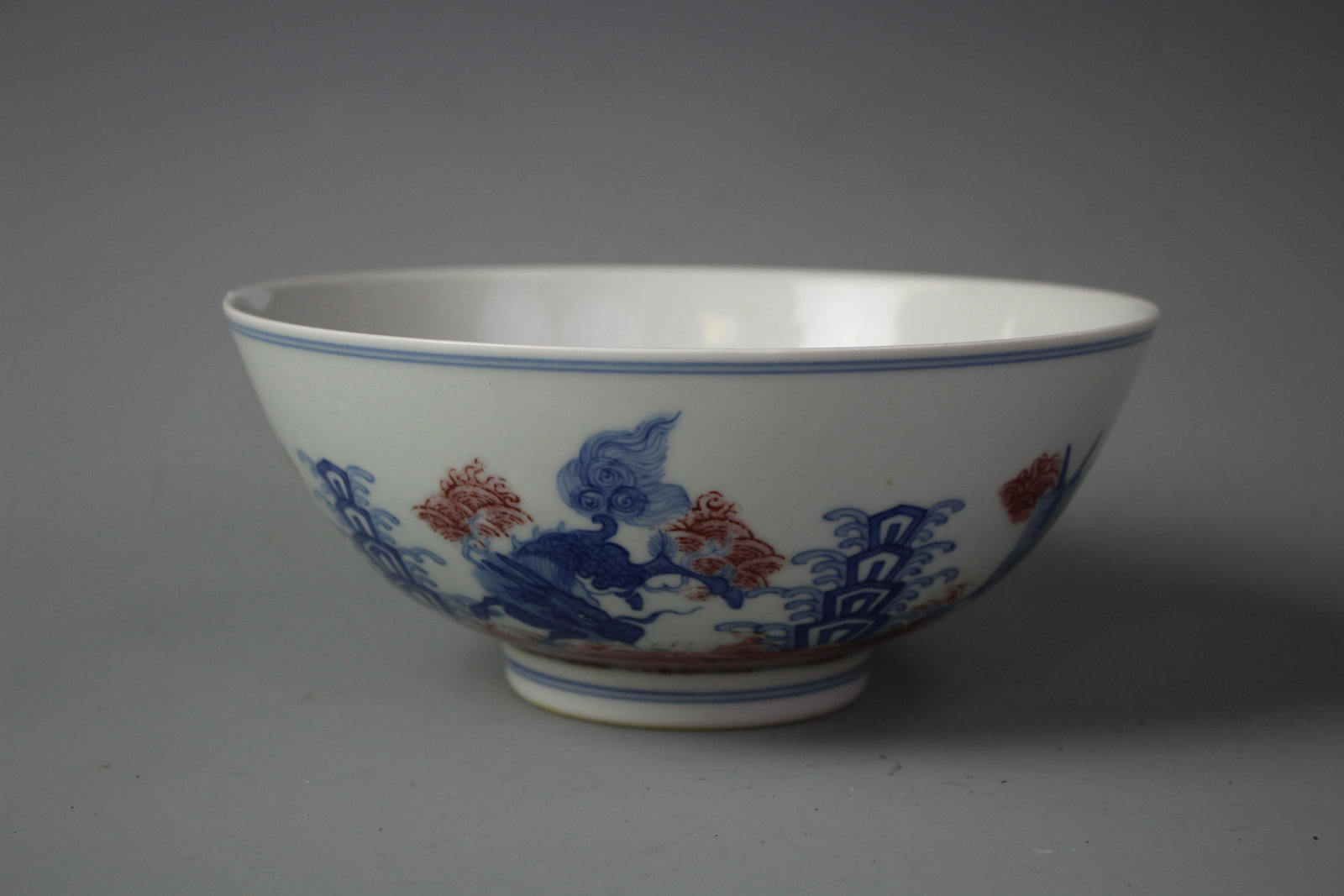 A Russet Blue And White Ground "Kylin" Bowl, Marked: A Russet Blue And White Ground "Kylin" Bowl, Marked Kangxi Period Qing Dynasty