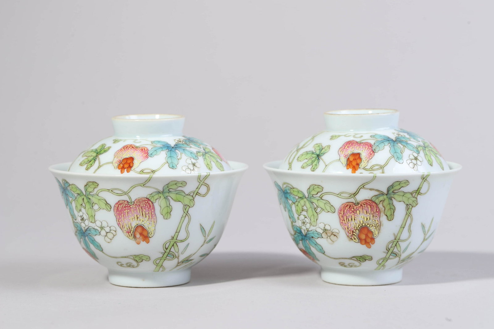 A PAIR OF FAMILLE ROSE TEACUPS AND COVERS. DAOGUANG PERIOD, QING DYNASTY. (1 of 10)