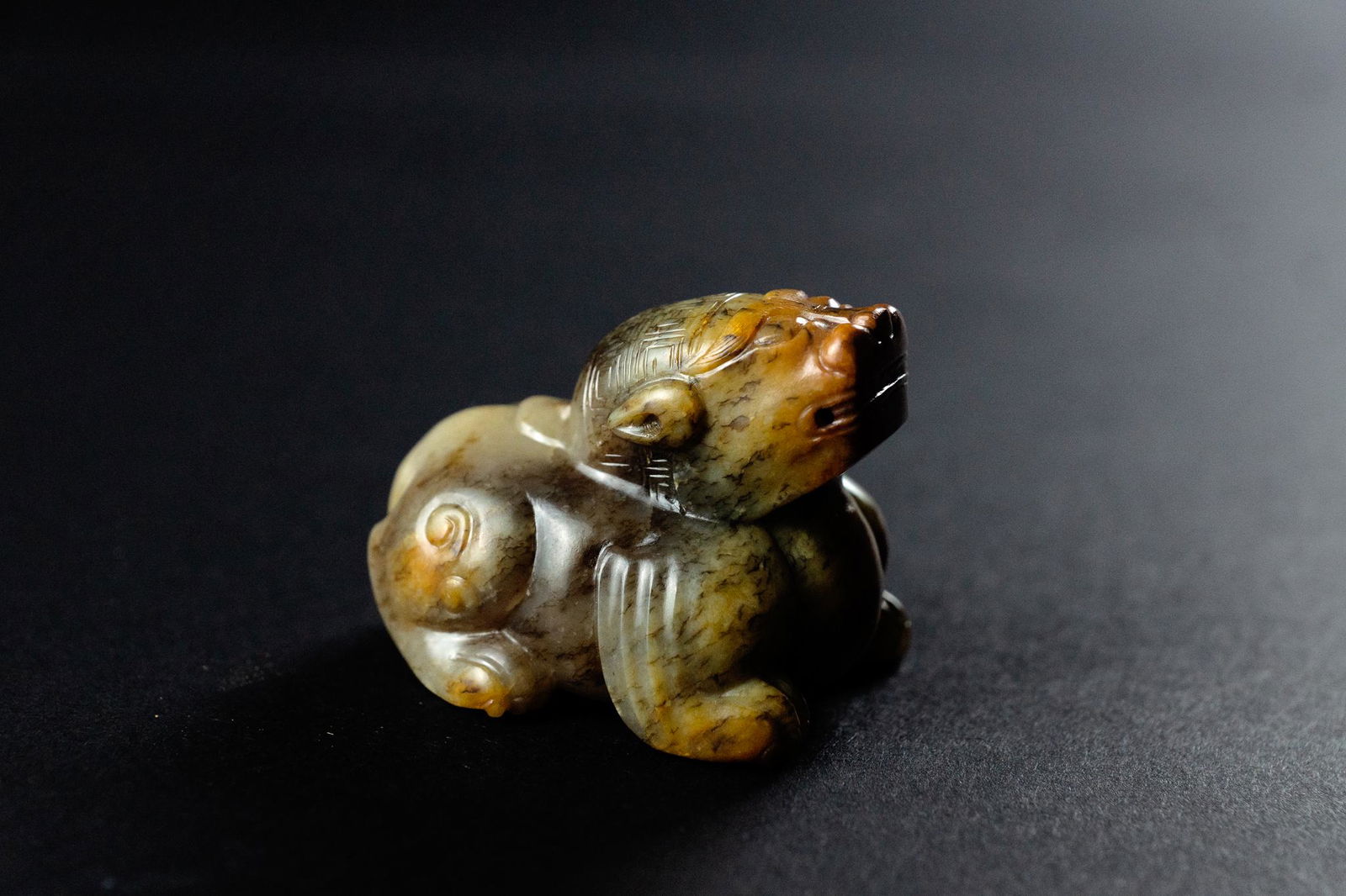 A YELLOW JADE FIGURE OF MYTHICAL BEAST (1 of 2)