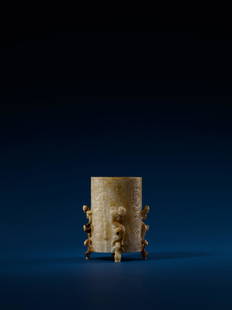 A WHITE JADE 'DRAGON' WINE VESSEL, 'ZHI', HAN (206 B.C.-220 A.D.): 漢 白玉鏤雕蟠螭四足卮 11 cm Height. 