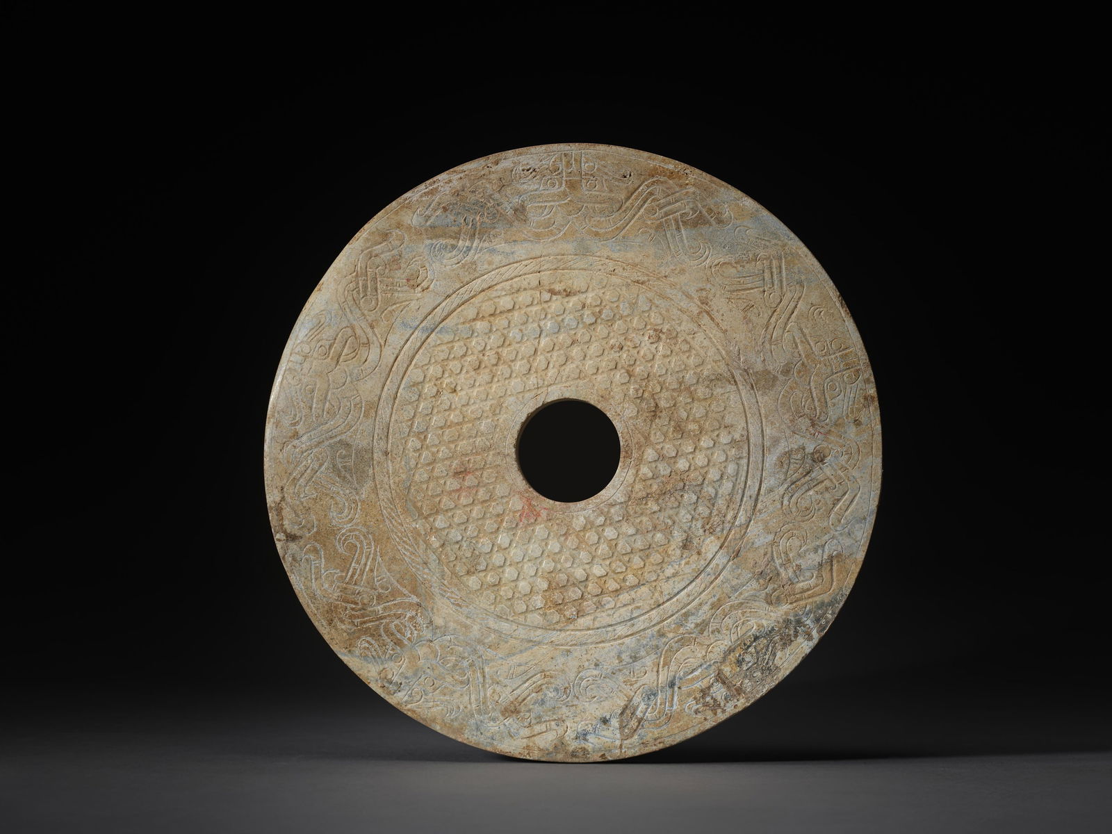 A LARGE CELADON JADE 'TAOTIE' DISC, BI: 品名: 戰國至漢 青玉饕餮蒲紋璧。年代(Age):WARRING STATES PERIOD TO HAN。 尺寸:30.2 cm D