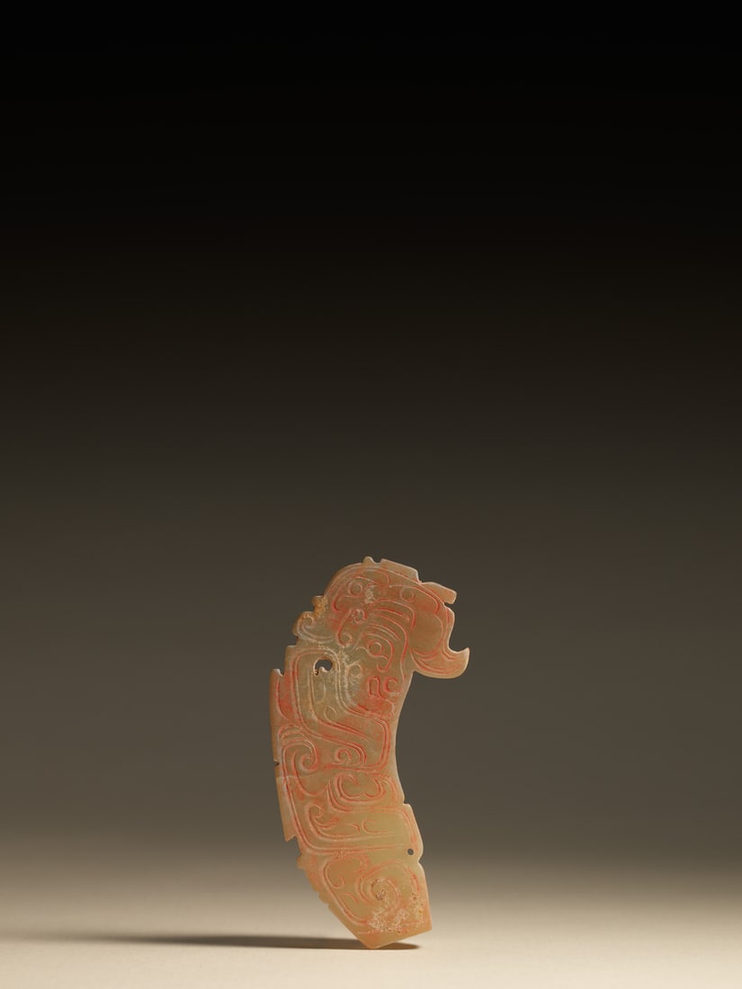 A JADE 'HUMAN-MASK' PENDANT (1 of 1)