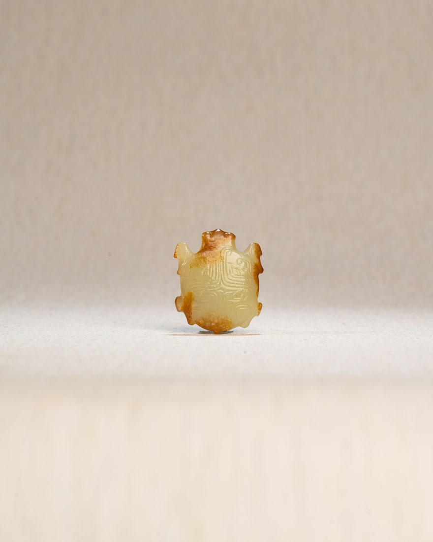A YELLOW JADE FIGURE OF A TURTLE (1 of 3)