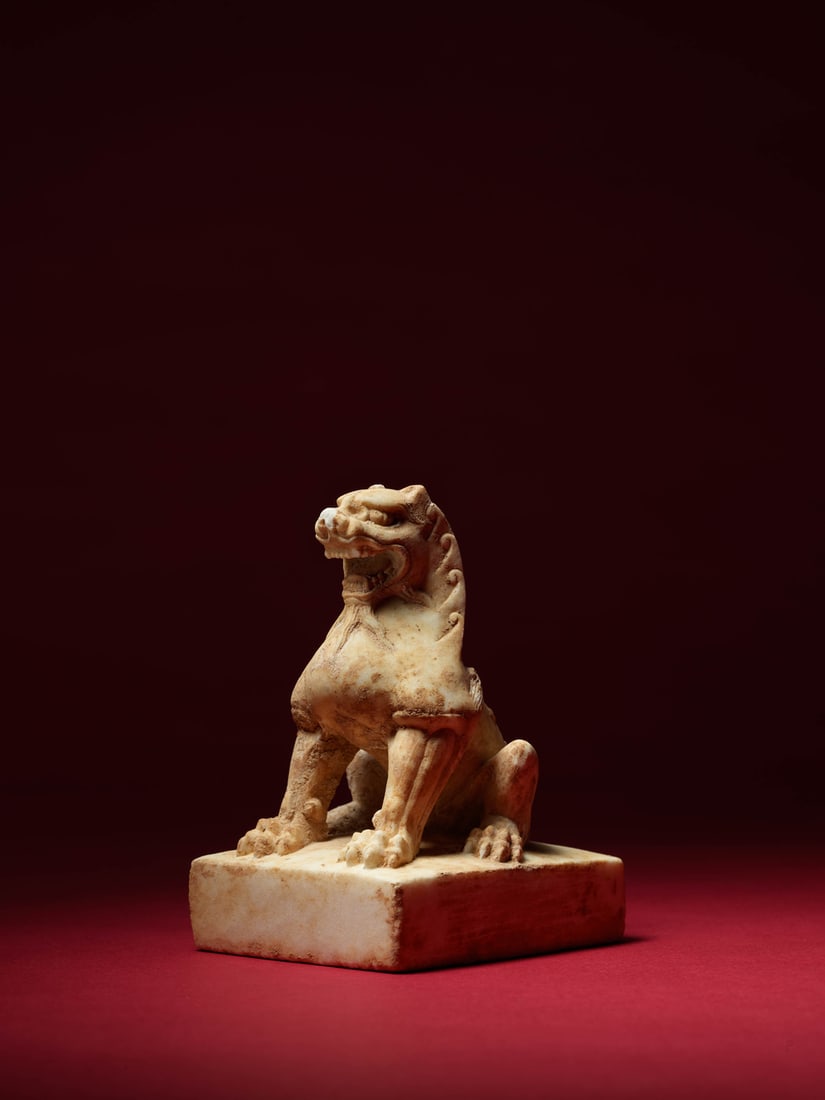 A MARBLE FIGURE OF A SEATED LION (1 of 2)