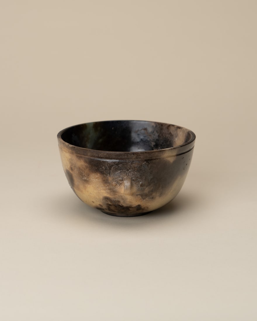 A JADE 'MASK' BOWL (1 of 3)