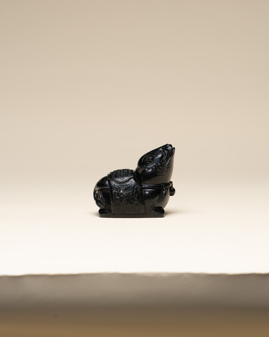 A STONE 'MYTHICAL BEAST' WASHER (1 of 2)
