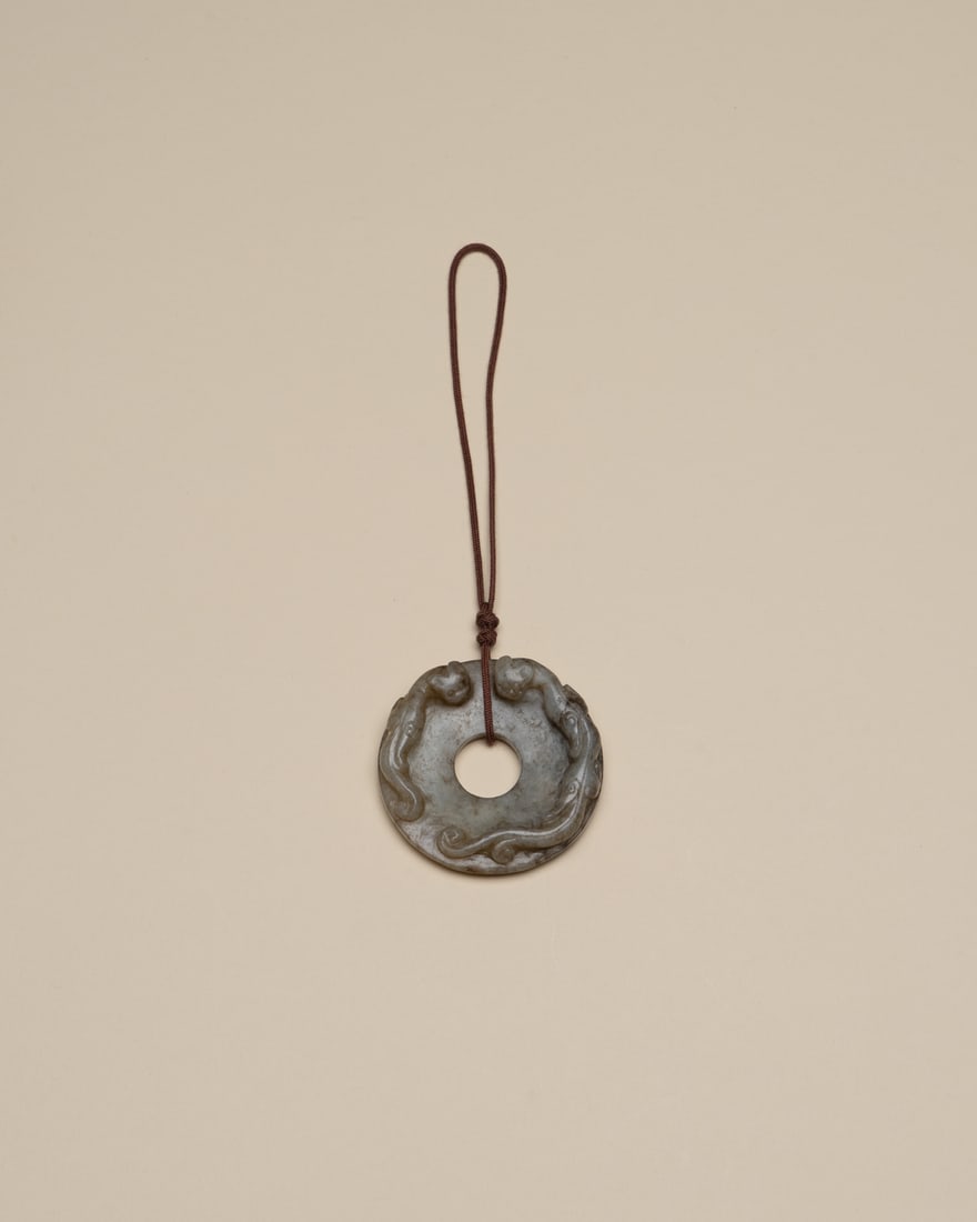 A JADE 'DRAGON' DISC, BI (1 of 2)