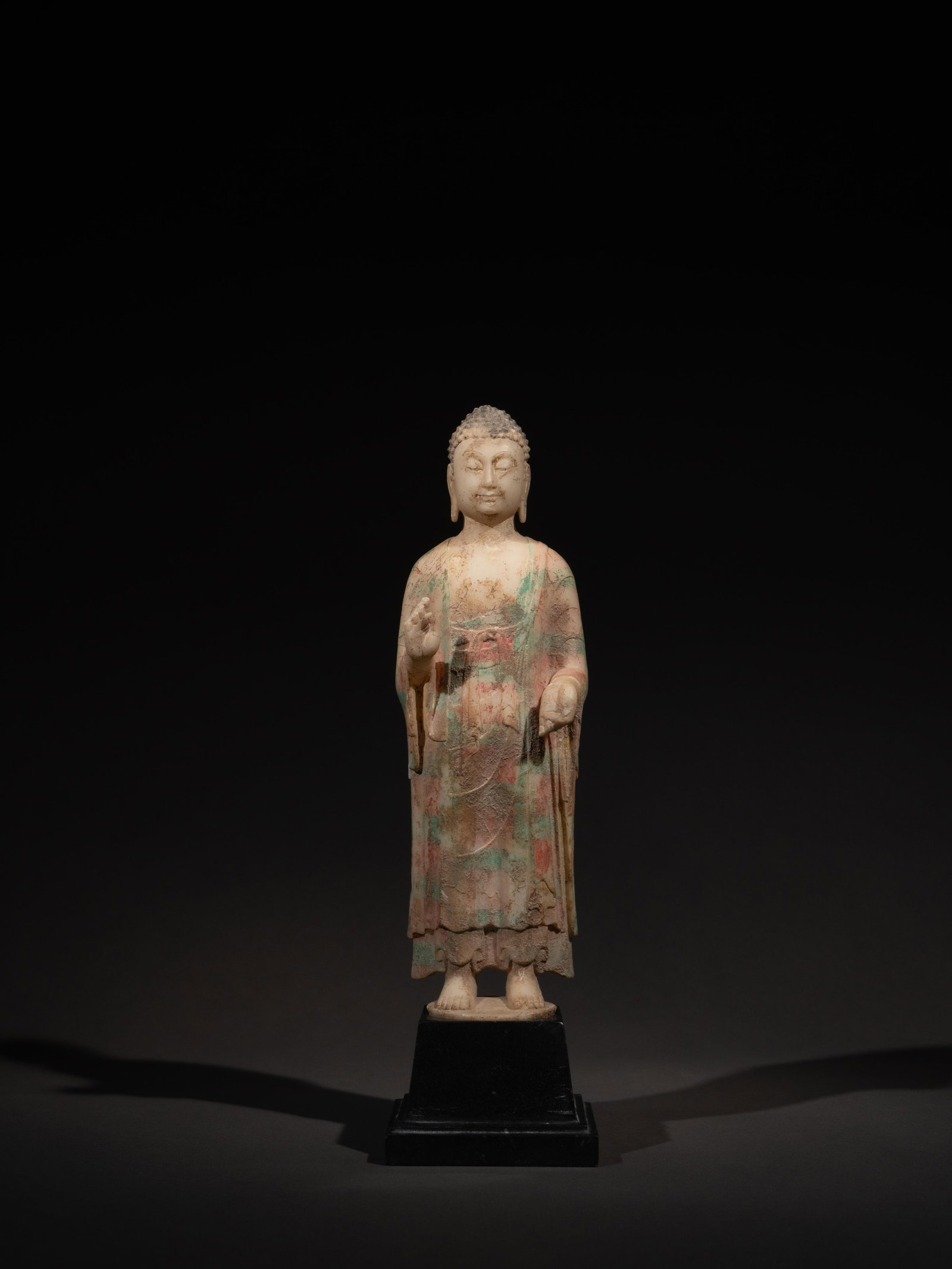 A PAINTED WHITE MARBLE FIGURE OF BUDDHA (1 of 4)