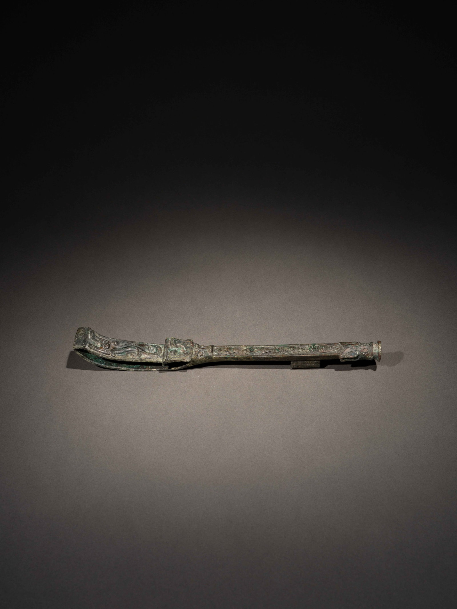 A BRONZE 'MASK' RIDING CROP (1 of 4)