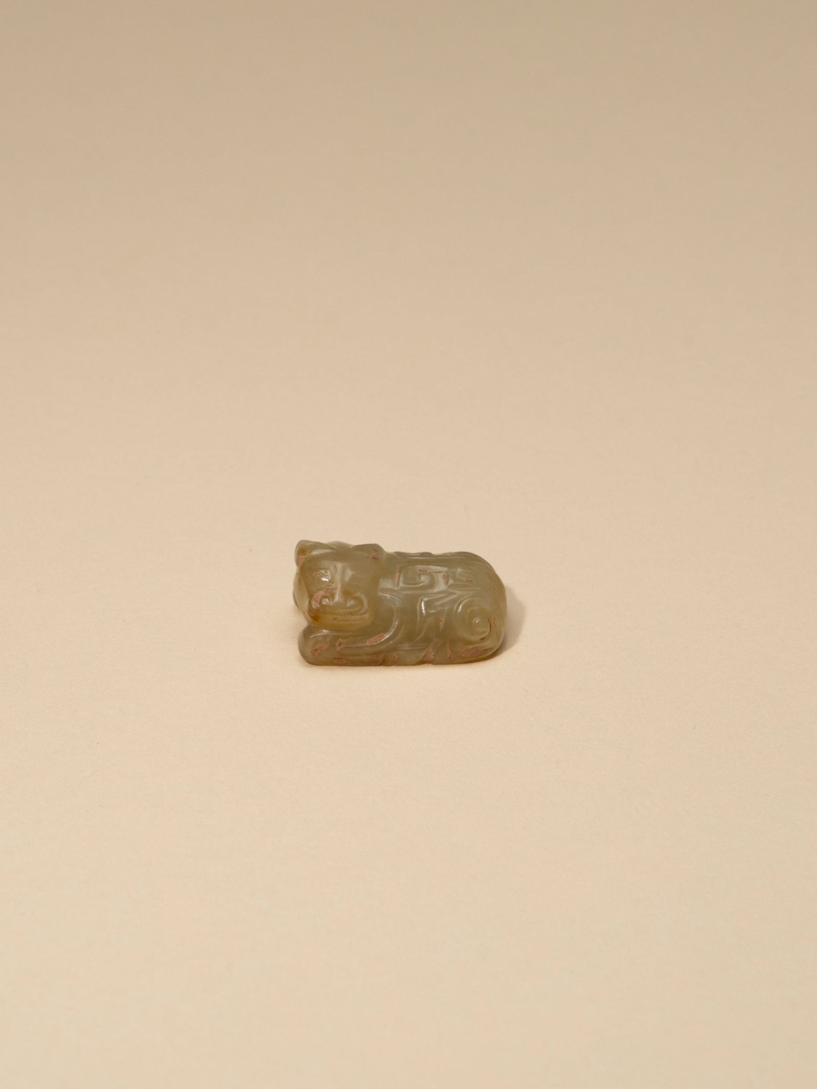 A WHITE JADE FIGURE OF OX (1 of 4)