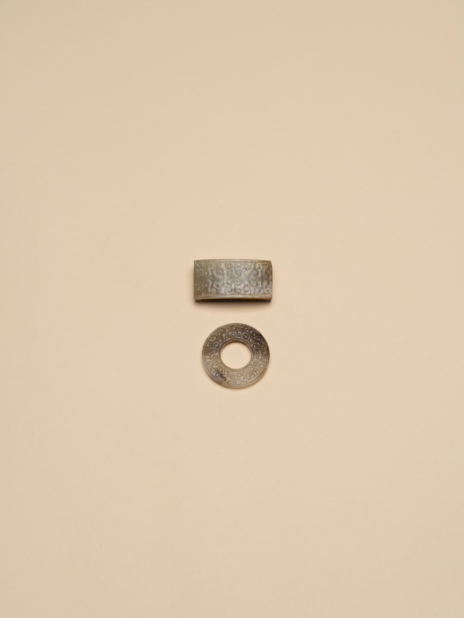 A JADE SCABBARD SLIDE AND A JADE DISC, HUAN (1 of 3)