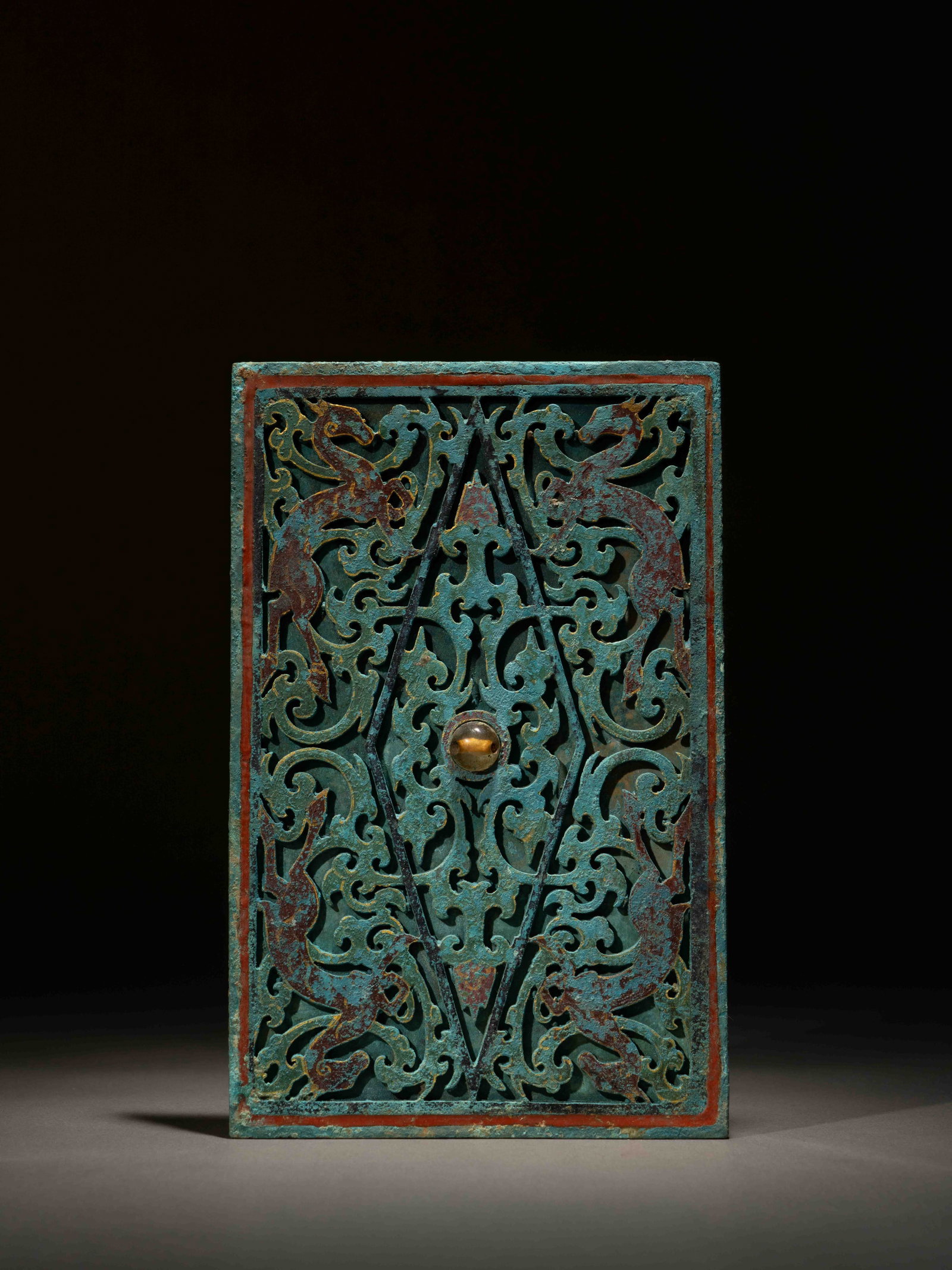 A PAINTED BRONZE 'MYTHICAL BEASTS' MIRROR: 年代(Age):HAN(206 B.C.-220 A.D.) 。尺寸(Size):19.8 cm Length, 12.8 cm Width。