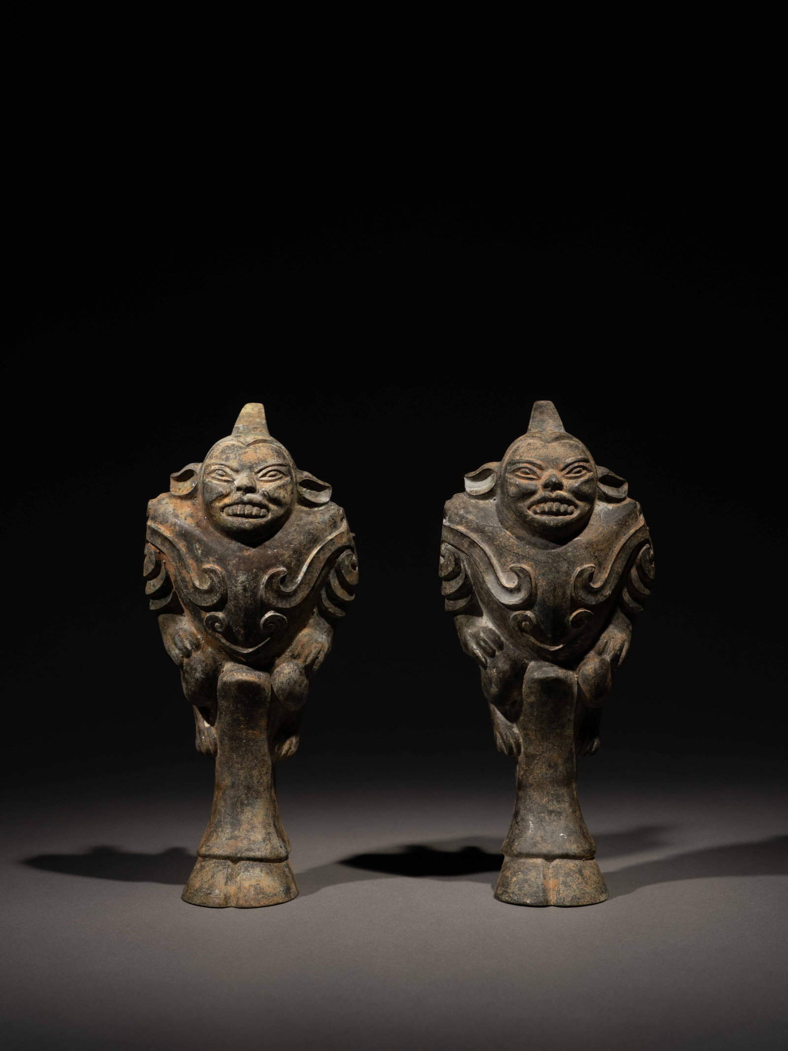 A PAIR OF BRONZE 'FIGURAL' DING LEGS (1 of 5)