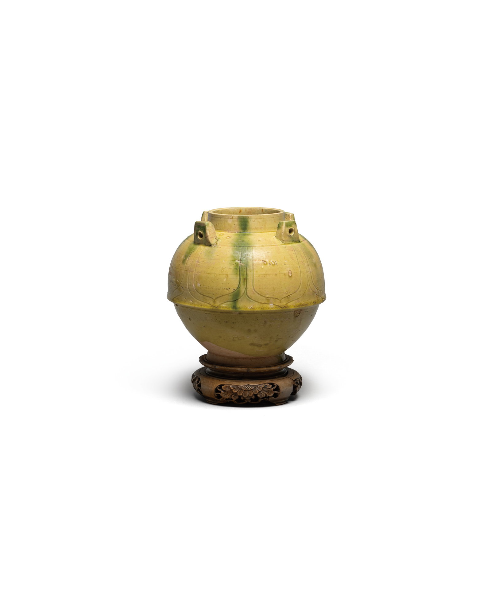 A GREEN AND BEIGE-GLAZED JAR: 年代(Age):NORTHERN QI(550-577 A.D.) 。尺寸(Size):17.1 cm Height。 參閱：北齊 黃釉綠彩四系刻&