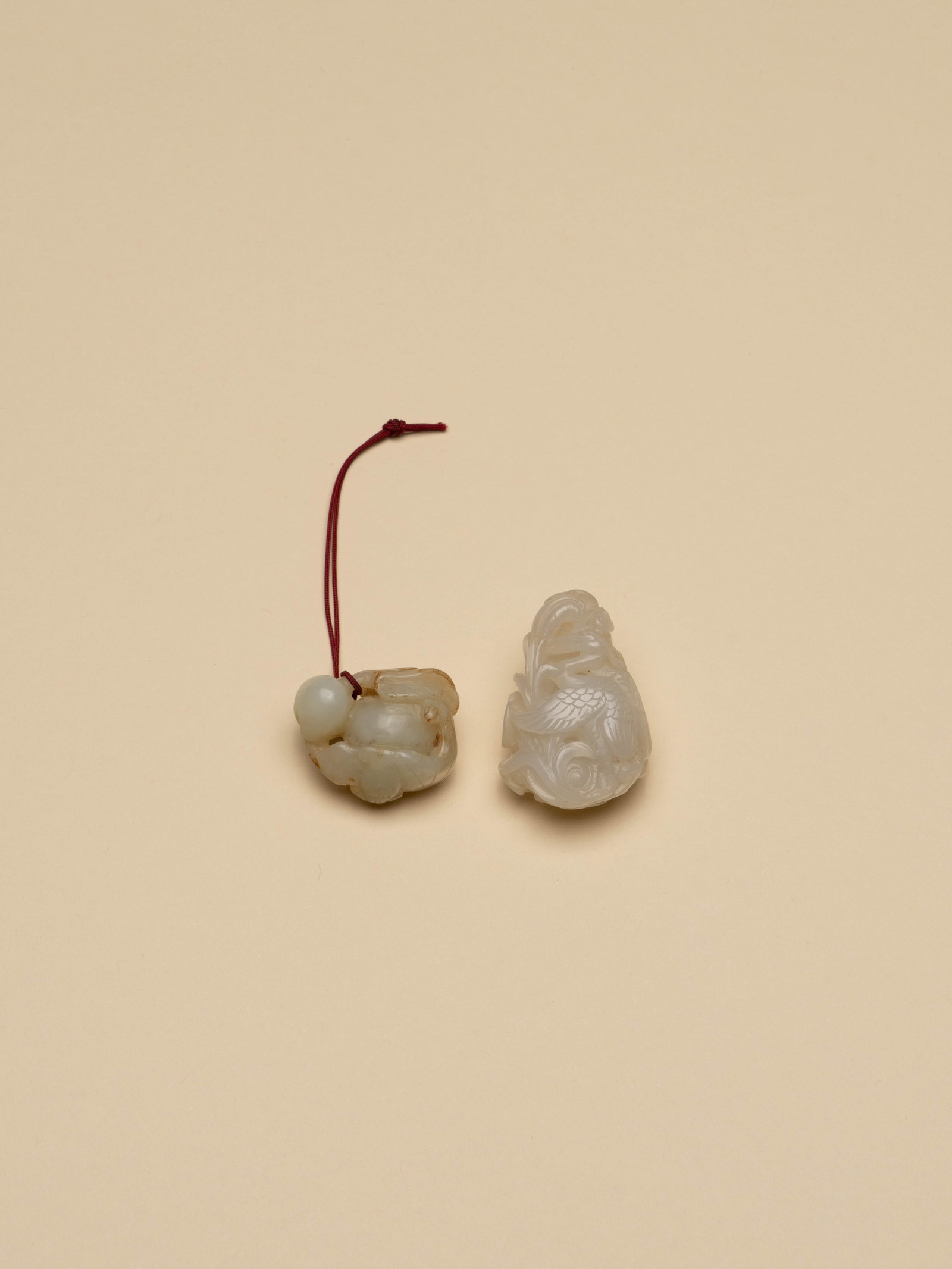 A GROUP OF WHITE JADE PENDANTS: 年代(Age):QING(1644-1911 A.D.) 。尺寸(Size):4.4 cm Height / 3.5 cm Height。