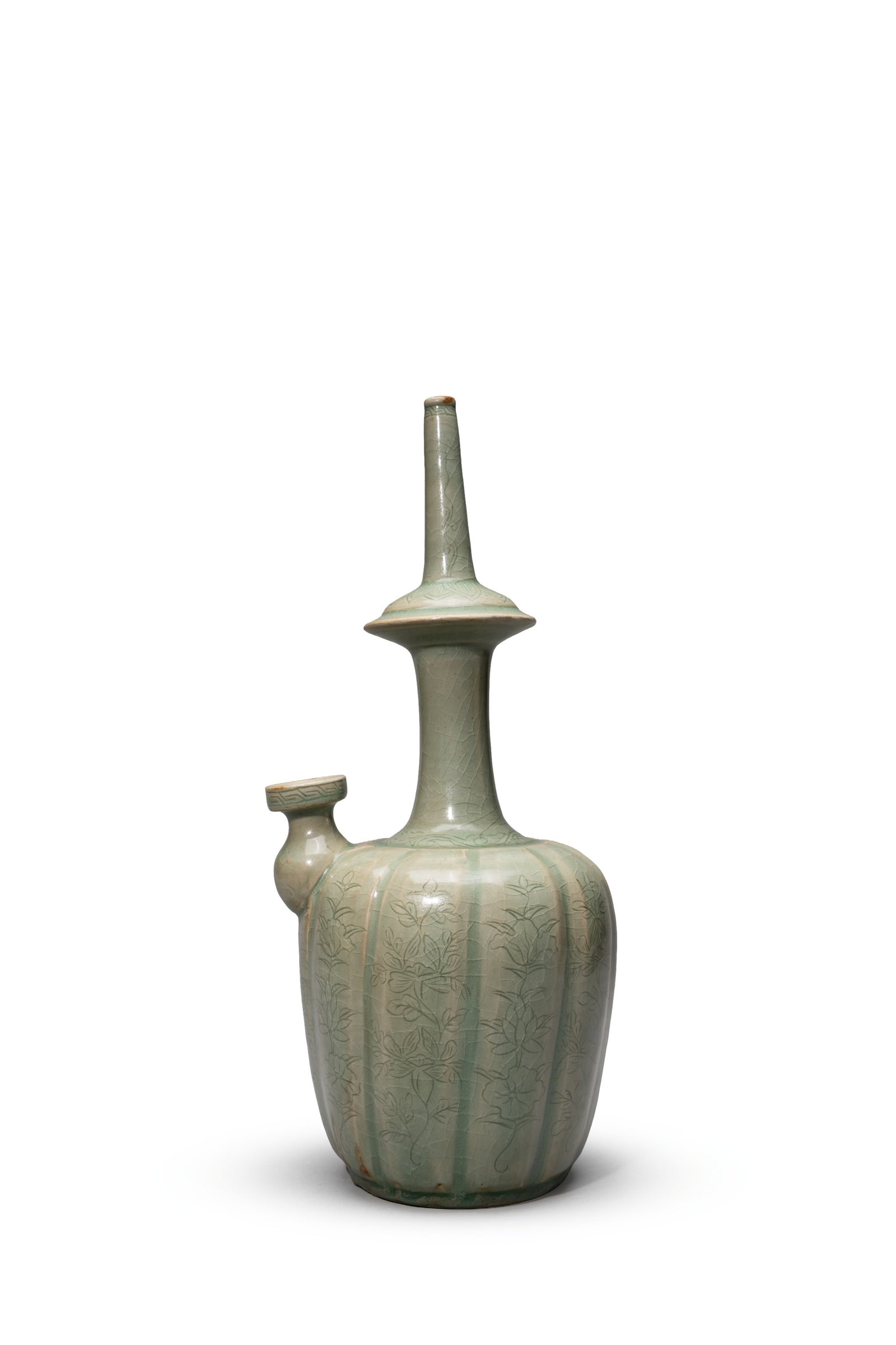 A CELADON-GLAZED 'FLORAL' KUNDIKA (1 of 5)