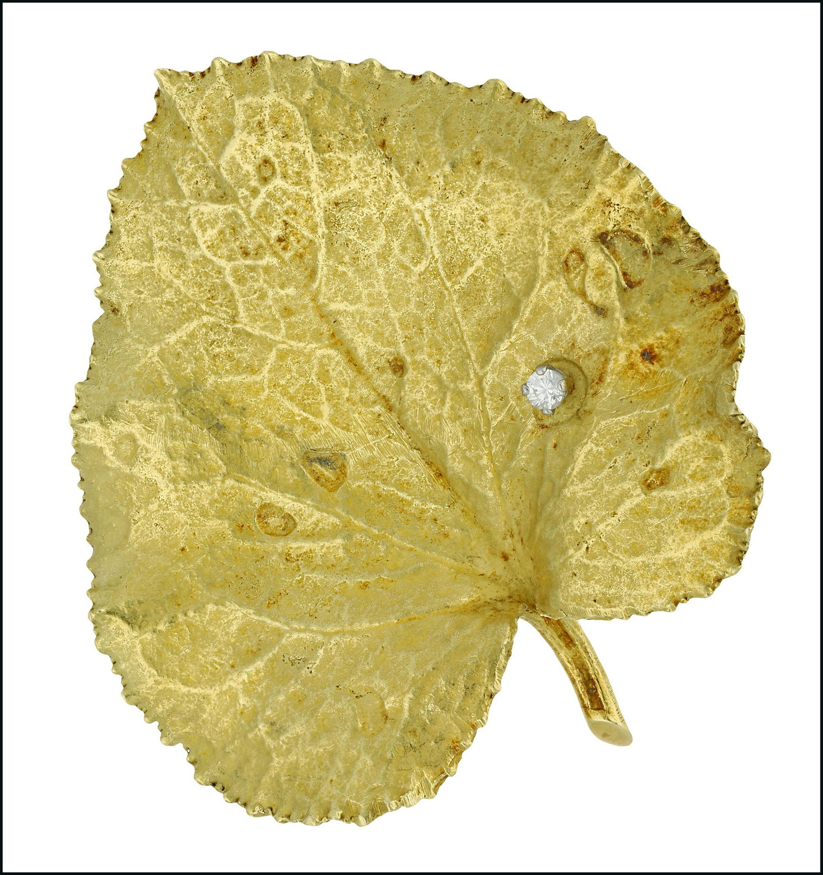 Jewellery: A gold and diamond set leaf brooch, by Andrew Grima, the realistically modelled lime leaf applied with a brilliant-cut diamond highlight, in four claw setting, stamped to the reverse â€˜GRIMAâ€