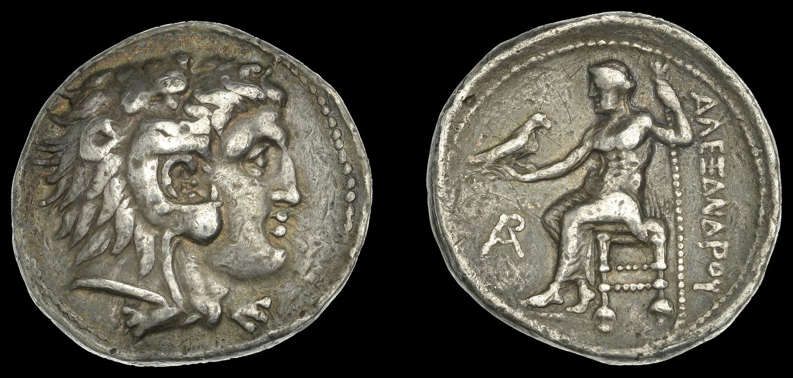 Ancient Coins from Various Properties: Greek Coinages, KINGS OF MACEDON, Alexander III, Tetradrachm, Byblos, c. 330-320, head of Herakles right wearing lion-skin, rev. Zeus seated left, holding eagle and sceptre, ar monogram in front, Î±
