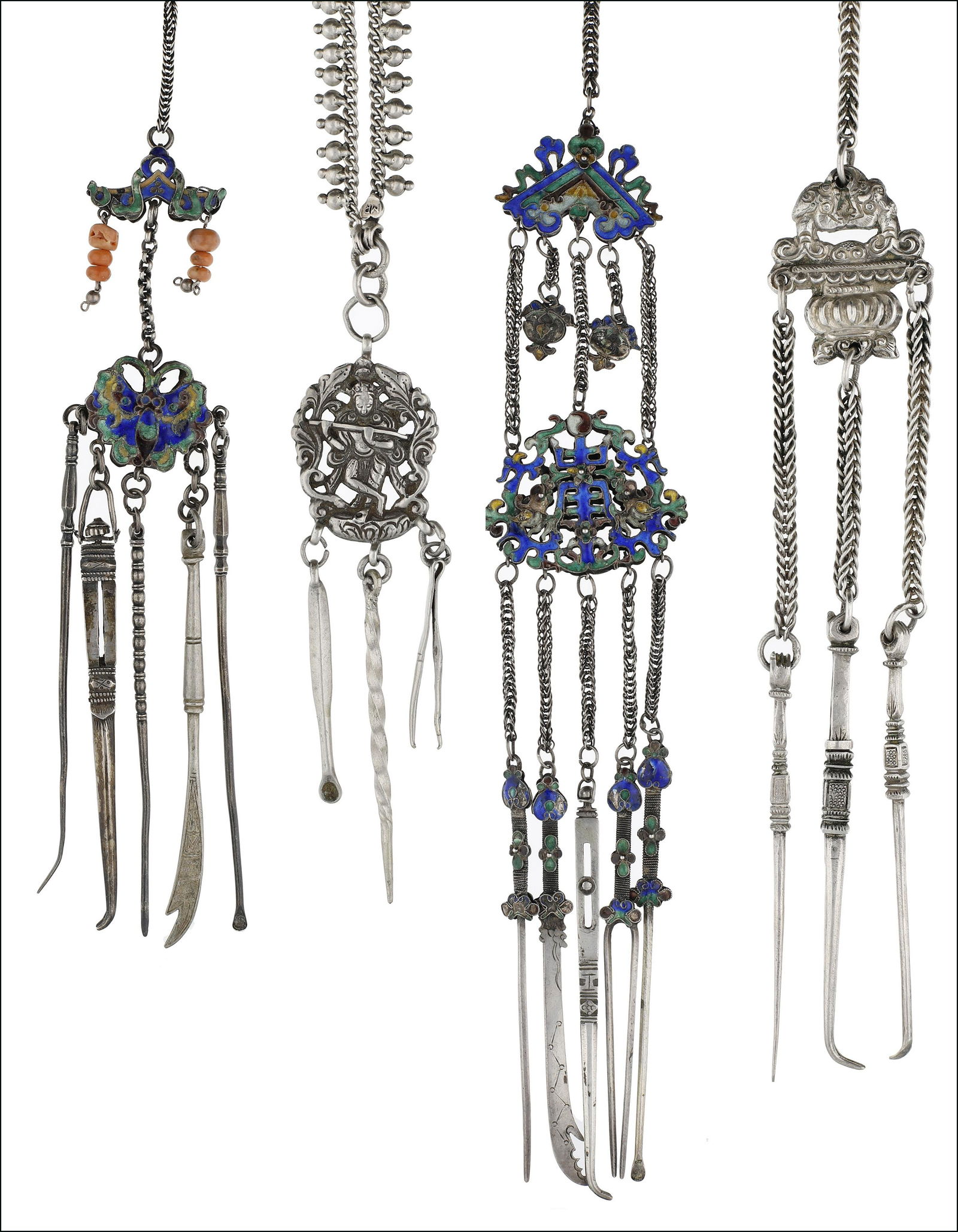 Objects of Vertu: A collection of Chinese and Eastern white metal chatelaines, including two double sided enamelled examples, suspending assorted grooming instruments including tongue scrapers, tooth picks, ear picks,