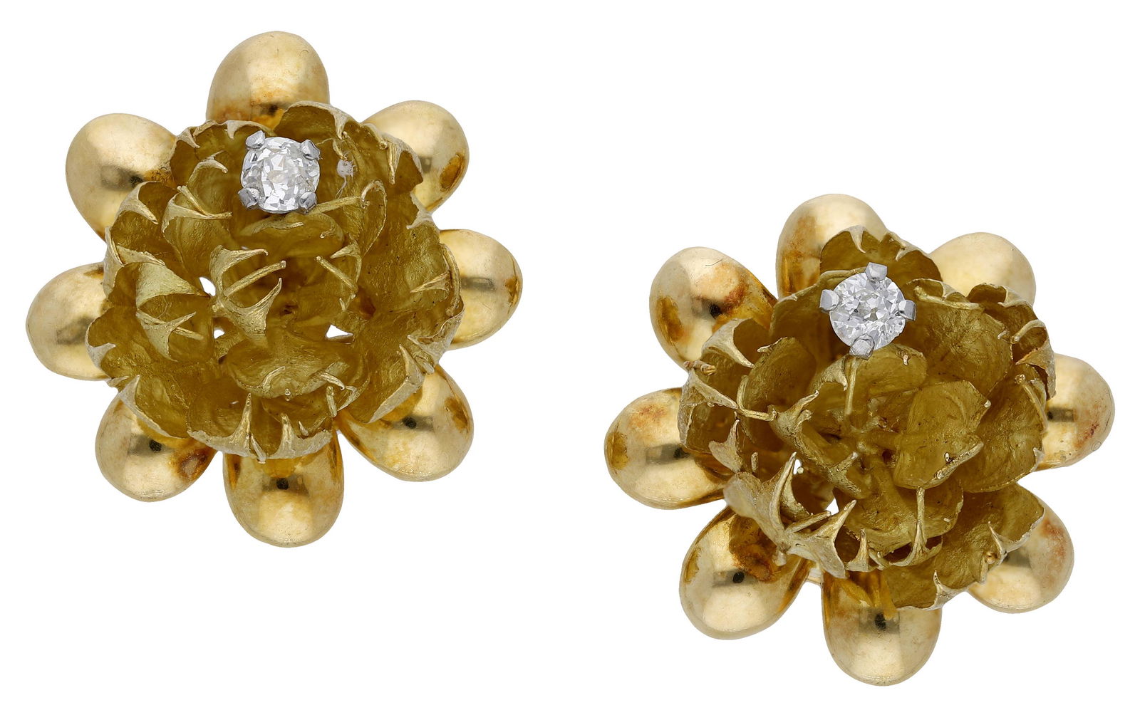 Jewellery: A pair of flowerhead earrings by Andrew Grima, the textured matt petals each supporting a claw set old-cut diamond highlight, to a surround of polished leaves, yellow precious metal, reverse bearing p