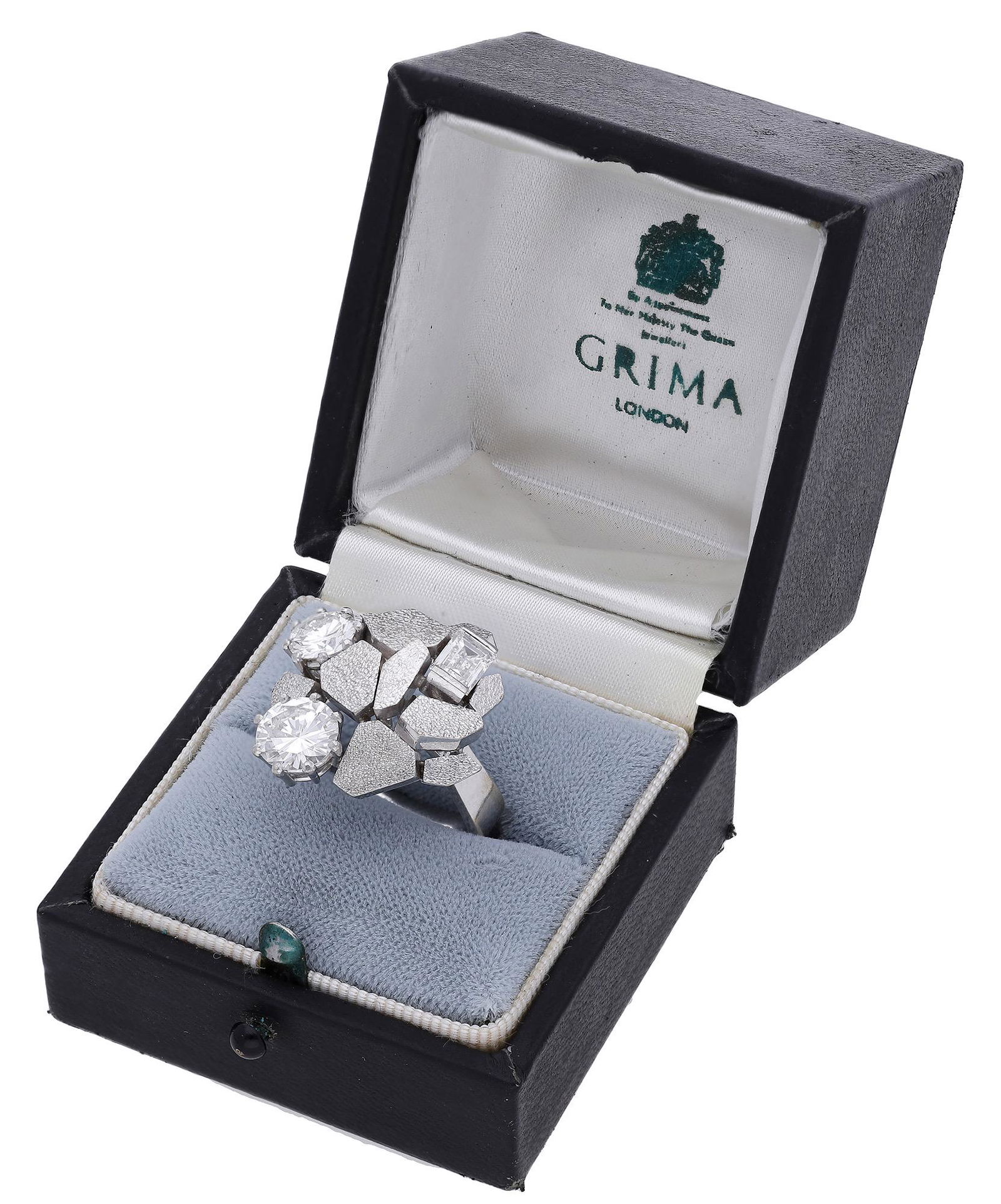 Jewellery: A diamond ring by Andrew Grima, 1972, the textured matt gold 'paving stones' set with a step-cut and two brilliant-cut diamonds between, on an angular-shaped shank, maker's mark 'AG.Ld', signed 'GRIMA